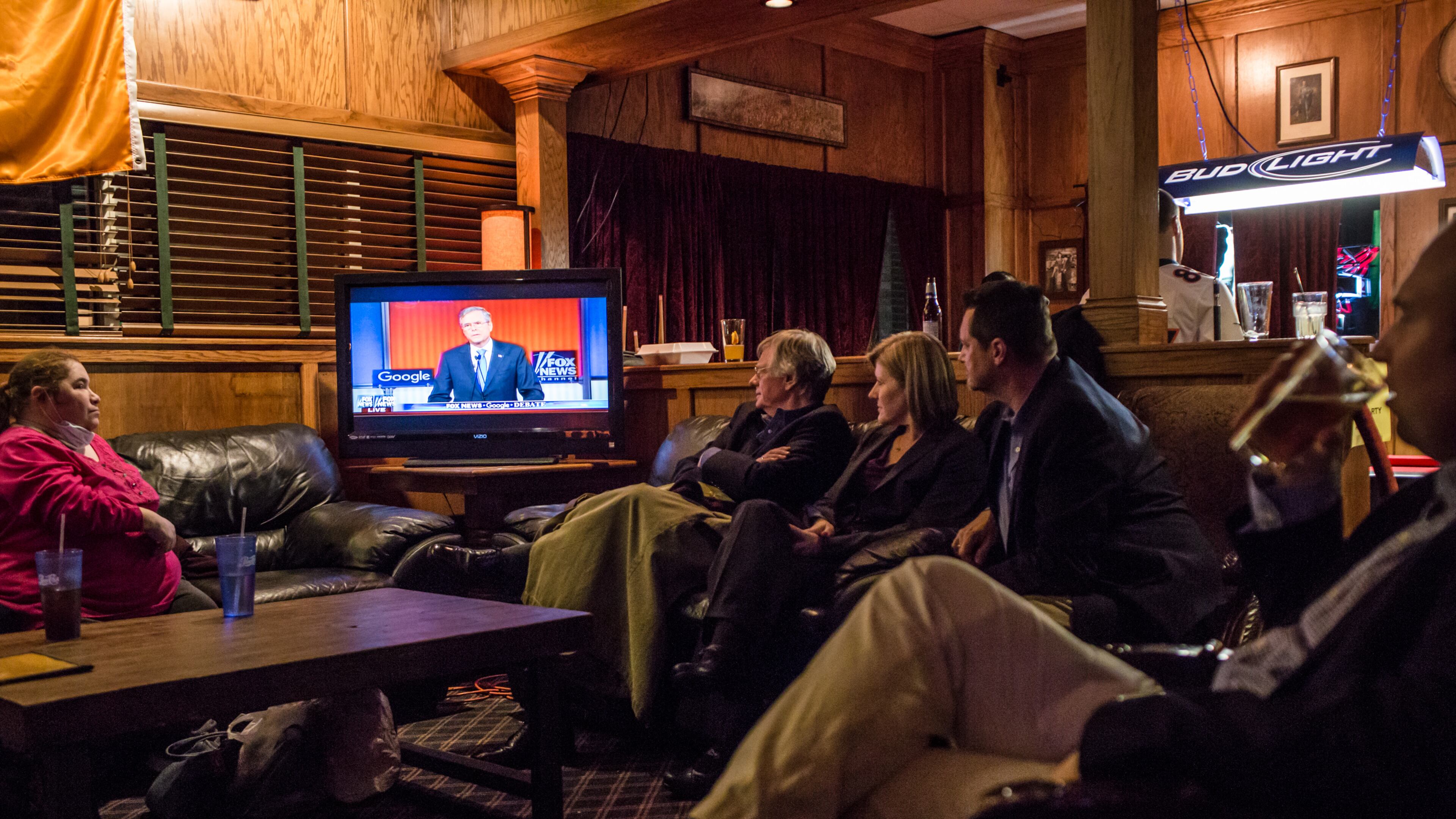 Members of the Dallas County GOP watch the Republican presidential debate at Mickey's Irish Pub on Thursday in Waukee, Iowa. Brendan Hoffman/Getty Images