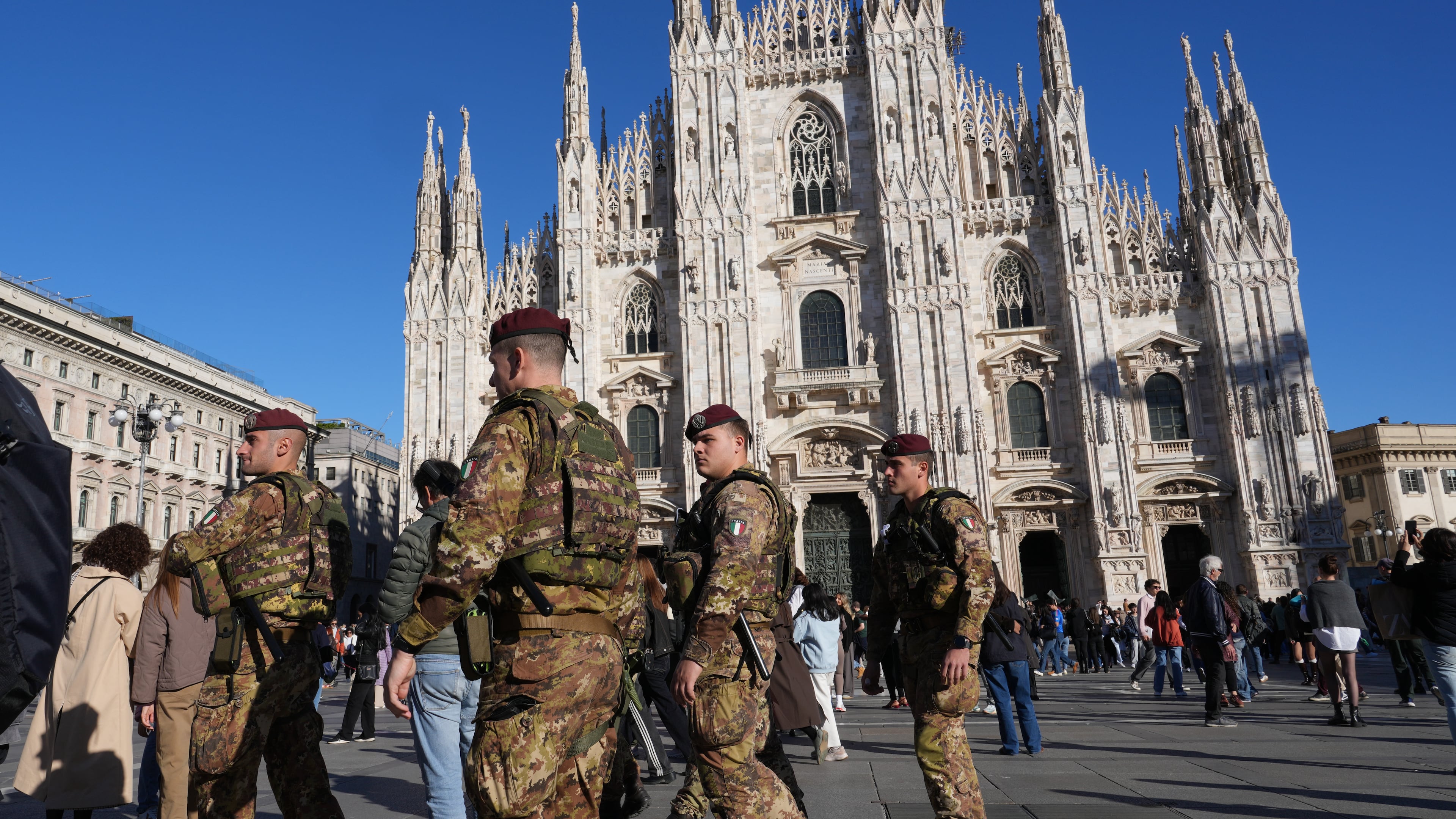 Italian army paratroopers patrol the area around Milan's Duomo Cathedral, Italy, Saturday, Oct. 24, 2026, ahead of expected protests against the rising cost of living and deteriorating public services during one of several protests in Italy organized by groups across the political spectrum. (AP Photo/Antonio Calanni)