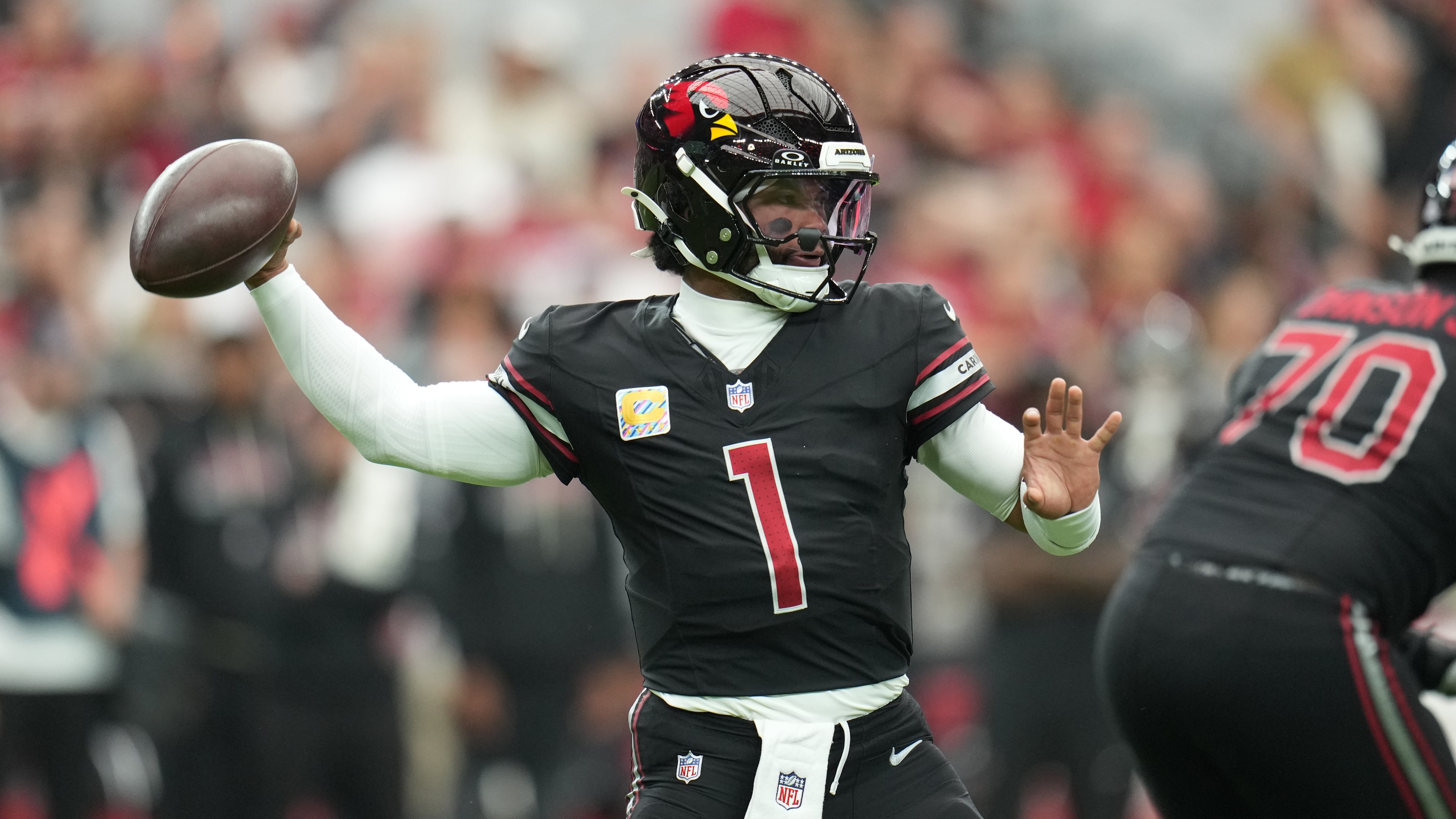 FILE - Arizona Cardinals quarterback Kyler Murray (1) throws a pass during the first half of an NFL football game against the Tennessee Titans, Oct. 5, 2025, in Glendale, Ariz. (AP Photo/Rick Scuteri, File)