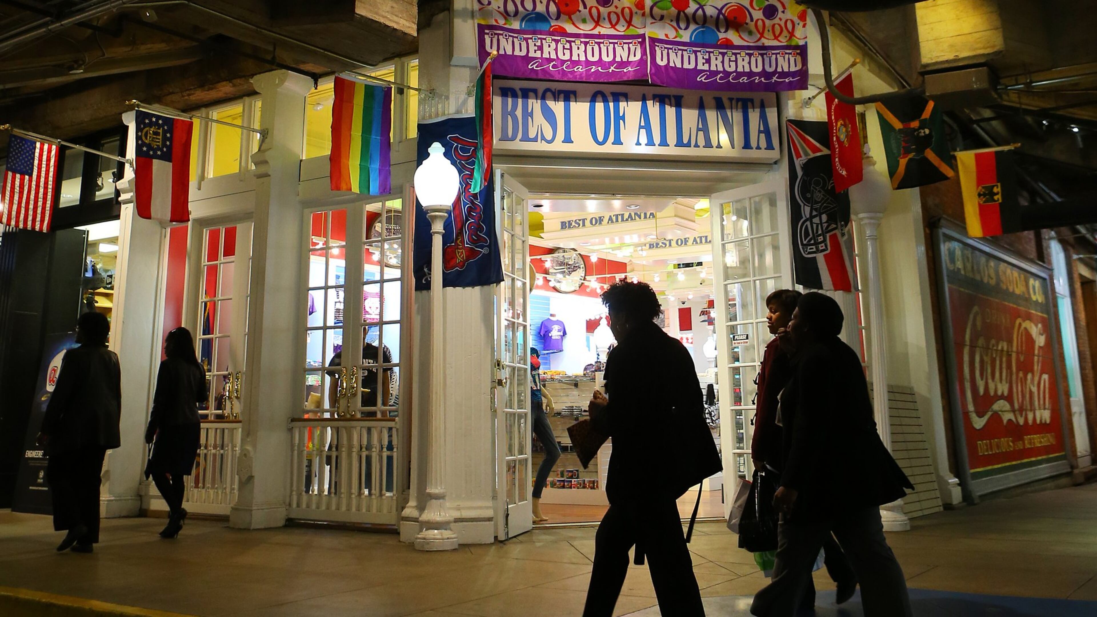 Visitors and shoppers walk past the Best of Atlanta store in Underground Atlanta on Wednesday, March 19, 2014, in Atlanta. Mayor Kasim Reed has vowed to sell the struggling downtown shopping and entertainment complex to a private developer. CURTIS COMPTON / CCOMPTON@AJC.COM
