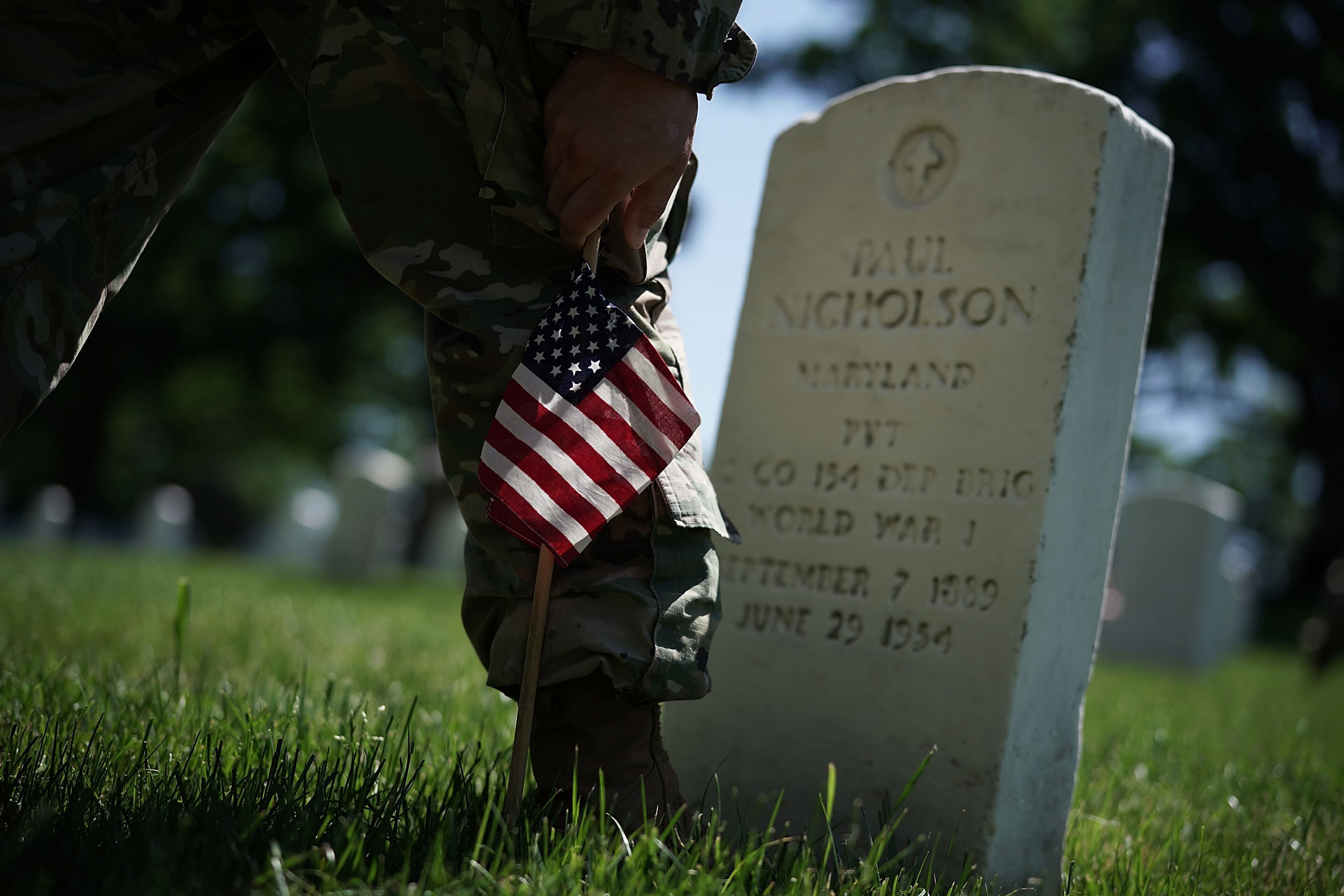 ARLINGTON, VA - MAY 24: A soldier with the U.S. Army 3rd Infantry Regiment (The Old Guard) participates in a "Flags In" event May 24, 2018 at Arlington National Cemetery in Arlington, Virginia. The cemetery hosts the annual event to adorn all cemetery graves with U.S. flags in advance of Memorial Day. (Photo by Alex Wong/Getty Images)