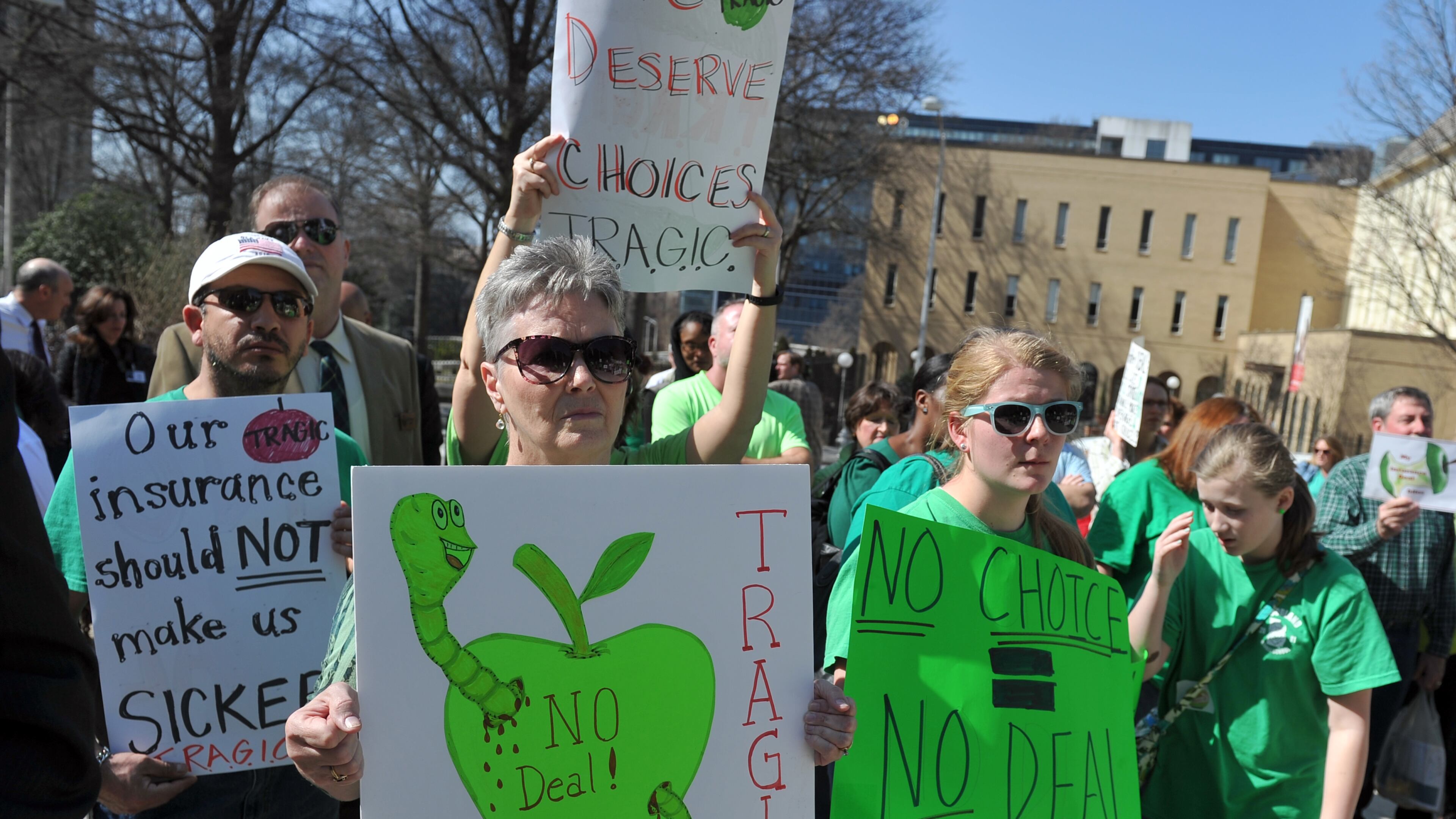 Supporters of T.R.A.G.I.C. (Teachers Rally to Advocate for Georgia Insurance Choices) protest outside the state Capitol earlier this year. (AJC Photo / Brant Sanderlin)
