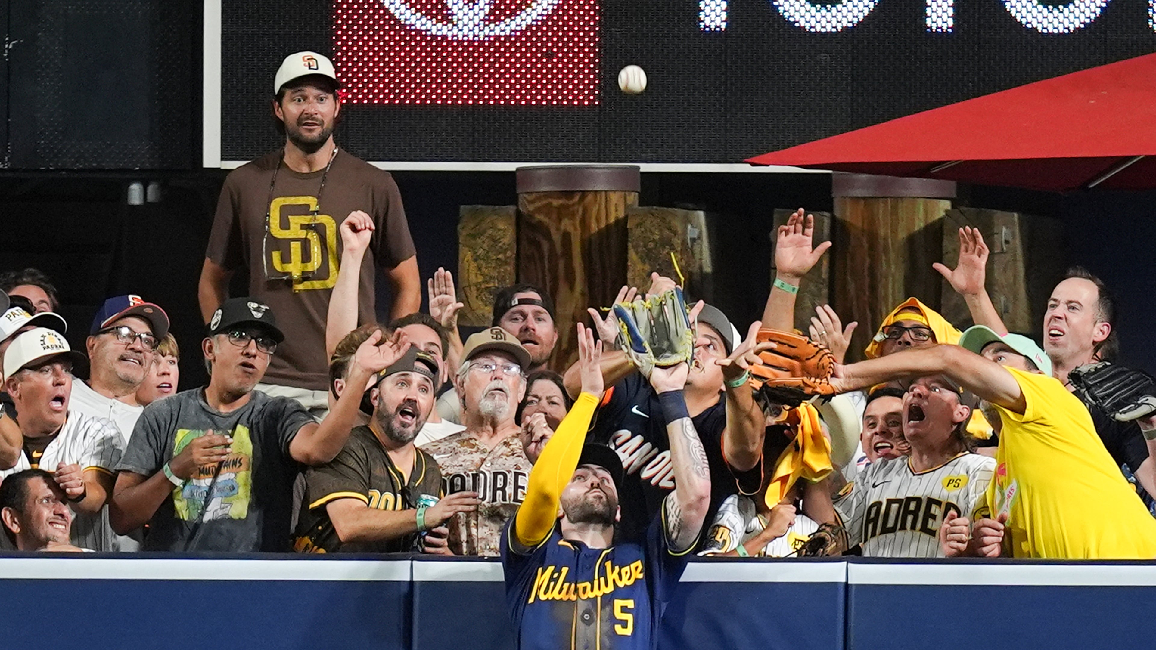Milwaukee Brewers center fielder Garrett Mitchell catches a ball hit by San Diego Padres' Manny Machado during the eighth inning in Game 4 of baseball's National League Division Series Wednesday, Oct. 7, 2026, in San Diego. (AP Photo/Gregory Bull)