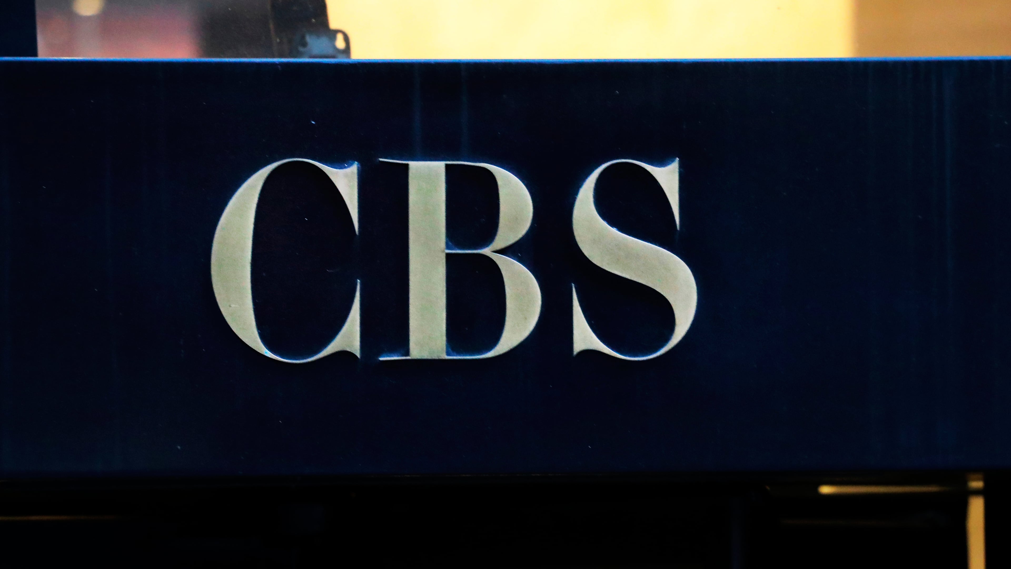 FILE - The CBS logo is displayed at the entrance to its headquarters, in New York, on Dec. 6, 2018. (AP Photo/Mark Lennihan, File)