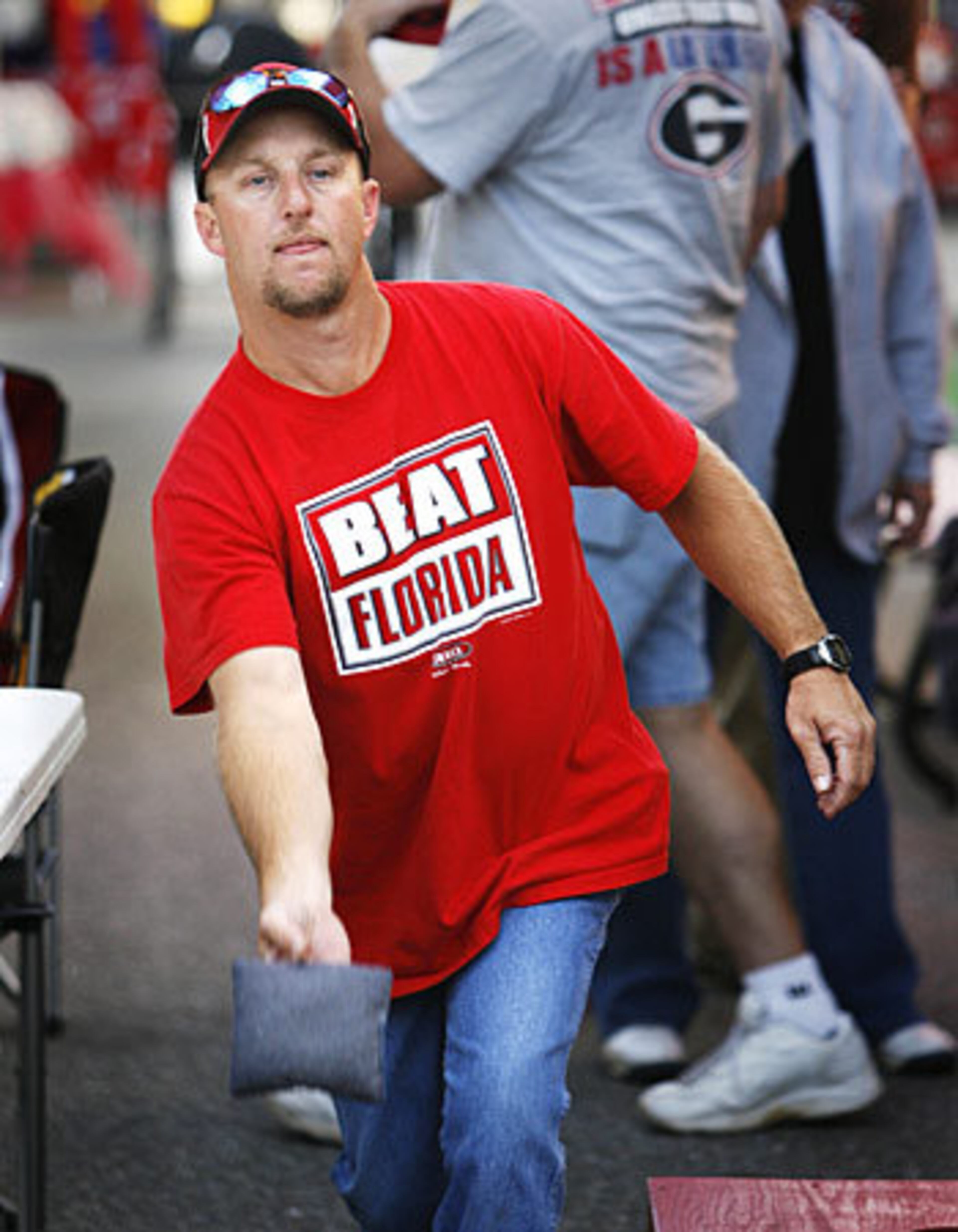 Charlie Miller, from Middleburg, Fla., plays "corn hole" by his RV. His family is from Rome so he is a Georgia fan.