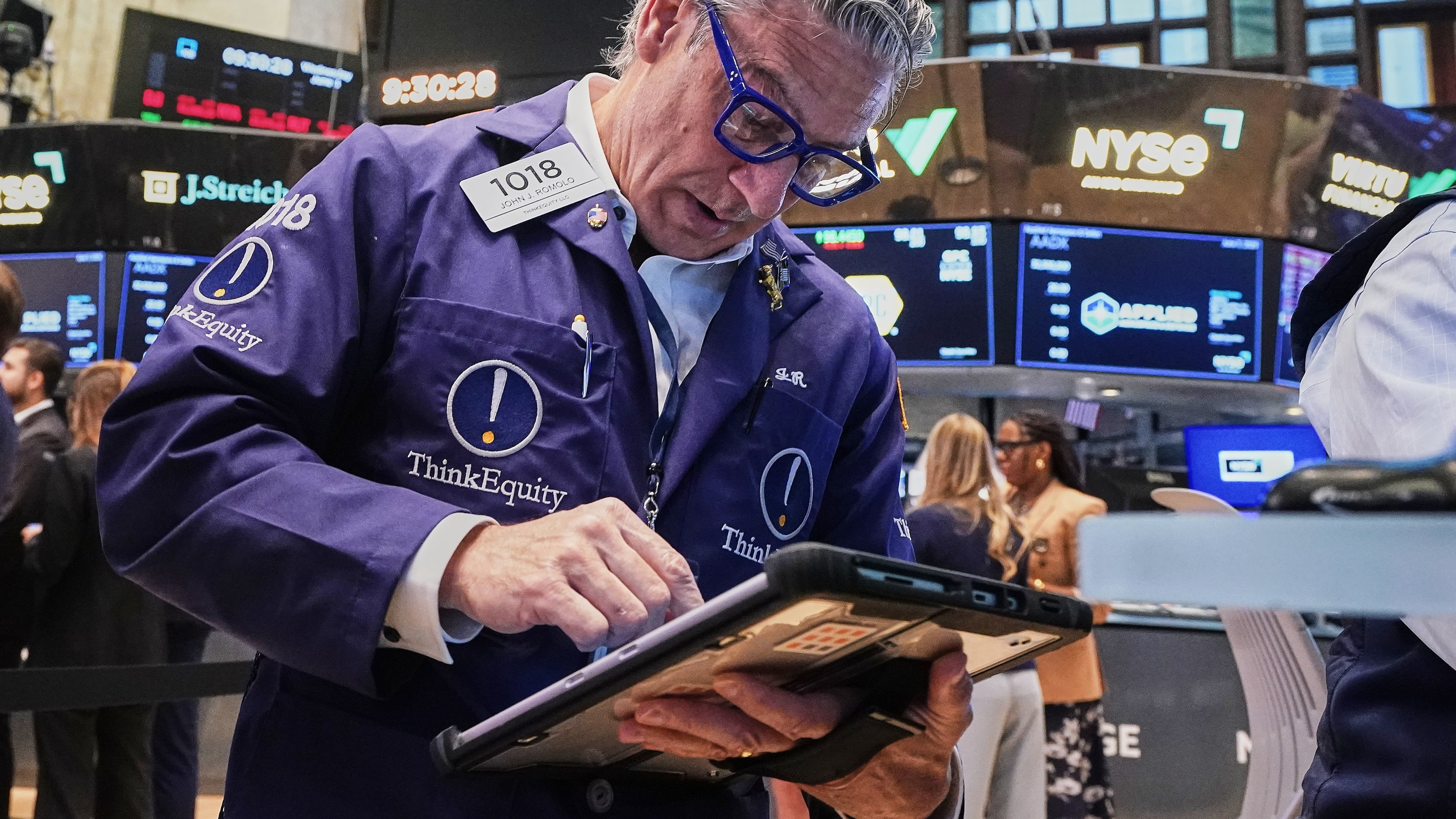 Trader John Romolo works on the floor of the New York Stock Exchange, Wednesday, June 3, 2026. (AP Photo/Richard Drew)