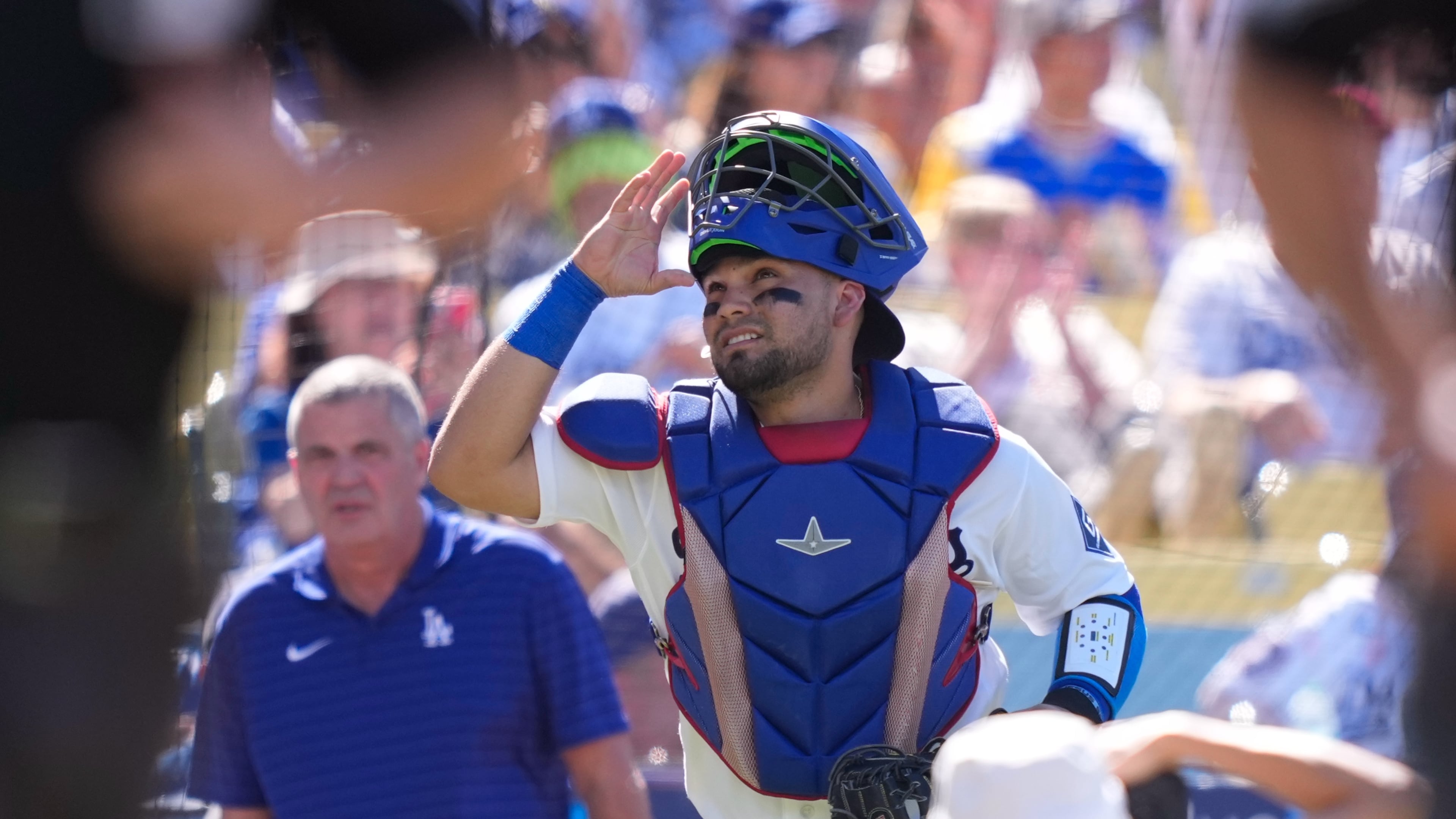 Los Angeles Dodgers catcher Eliezer Alfonzo looks toward the sky as he takes the field prior to a baseball game against the San Diego Padres, Sunday, July 5, 2026, in Los Angeles. (AP Photo/Mark J. Terrill)