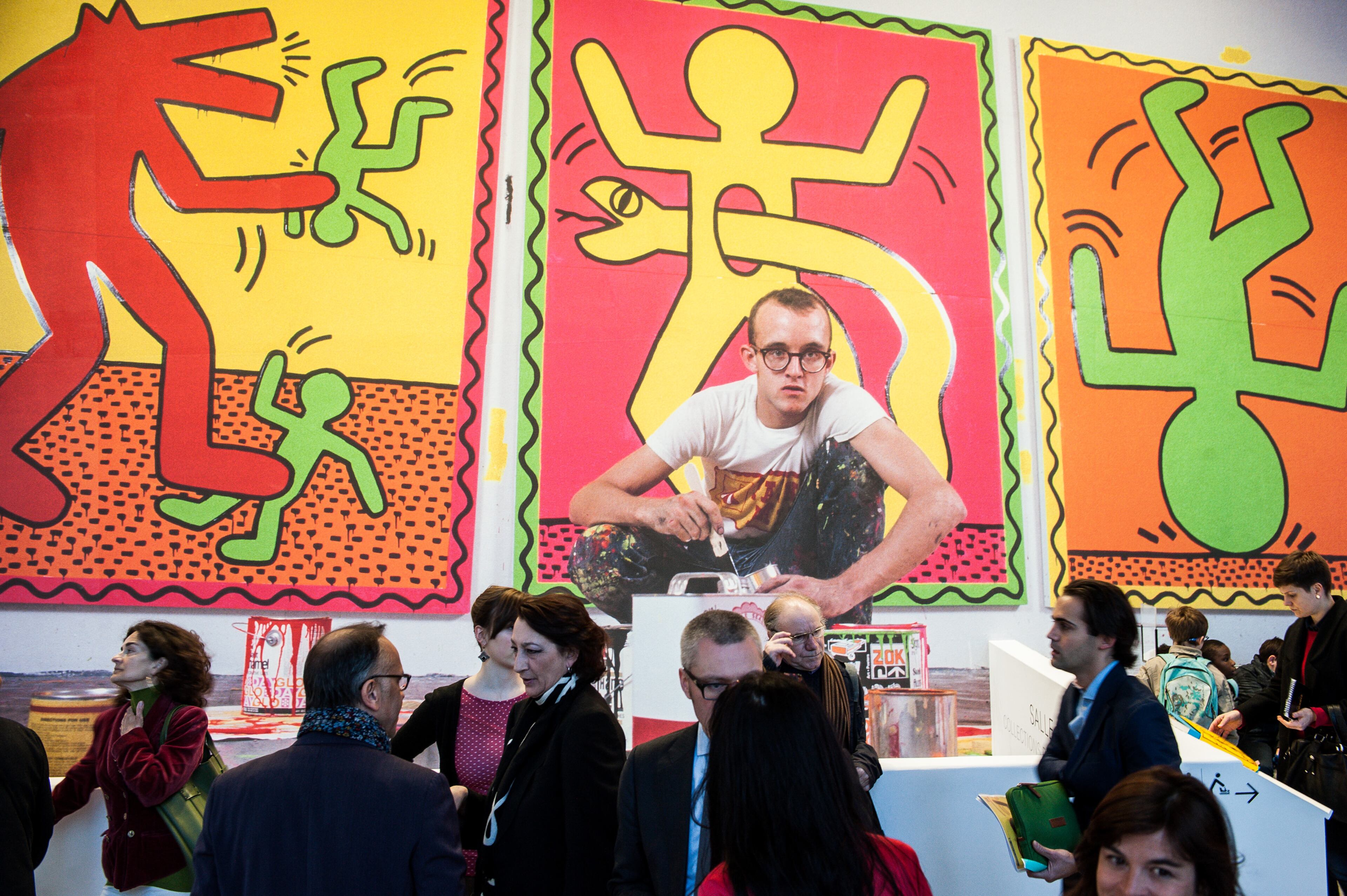 Visitors attend the Keith Haring Exhibition during a press preview at Musee d'Art Moderne on April 18, 2013 in Paris, France. (Photo by Francois Durand/Getty Images)