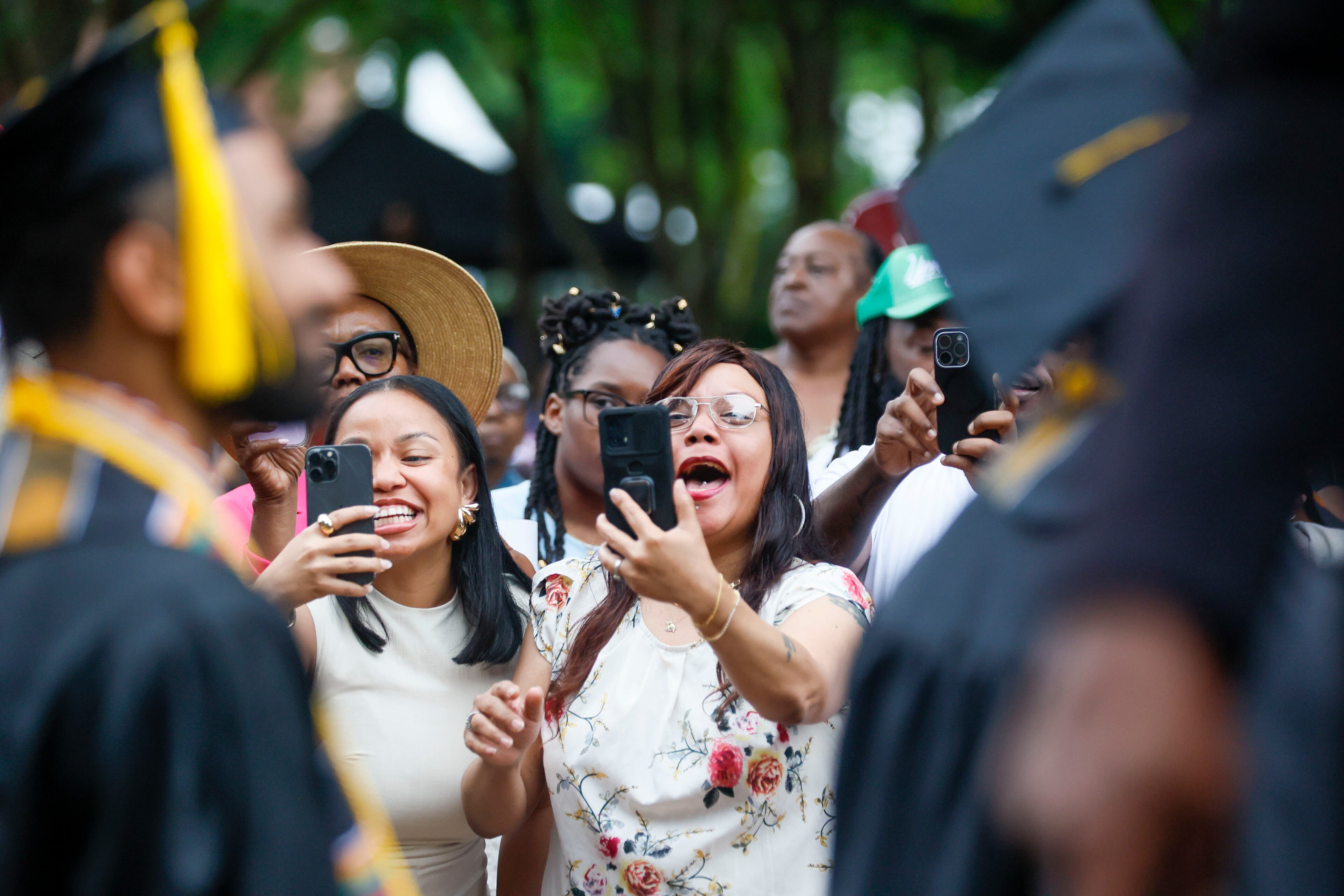 A family member wears a headband as they watch the graduate enter the ceremony during Morehouse College's 141st Commencement Ceremony on Sunday, May 18, 2025.
(Miguel Martinez/ AJC)