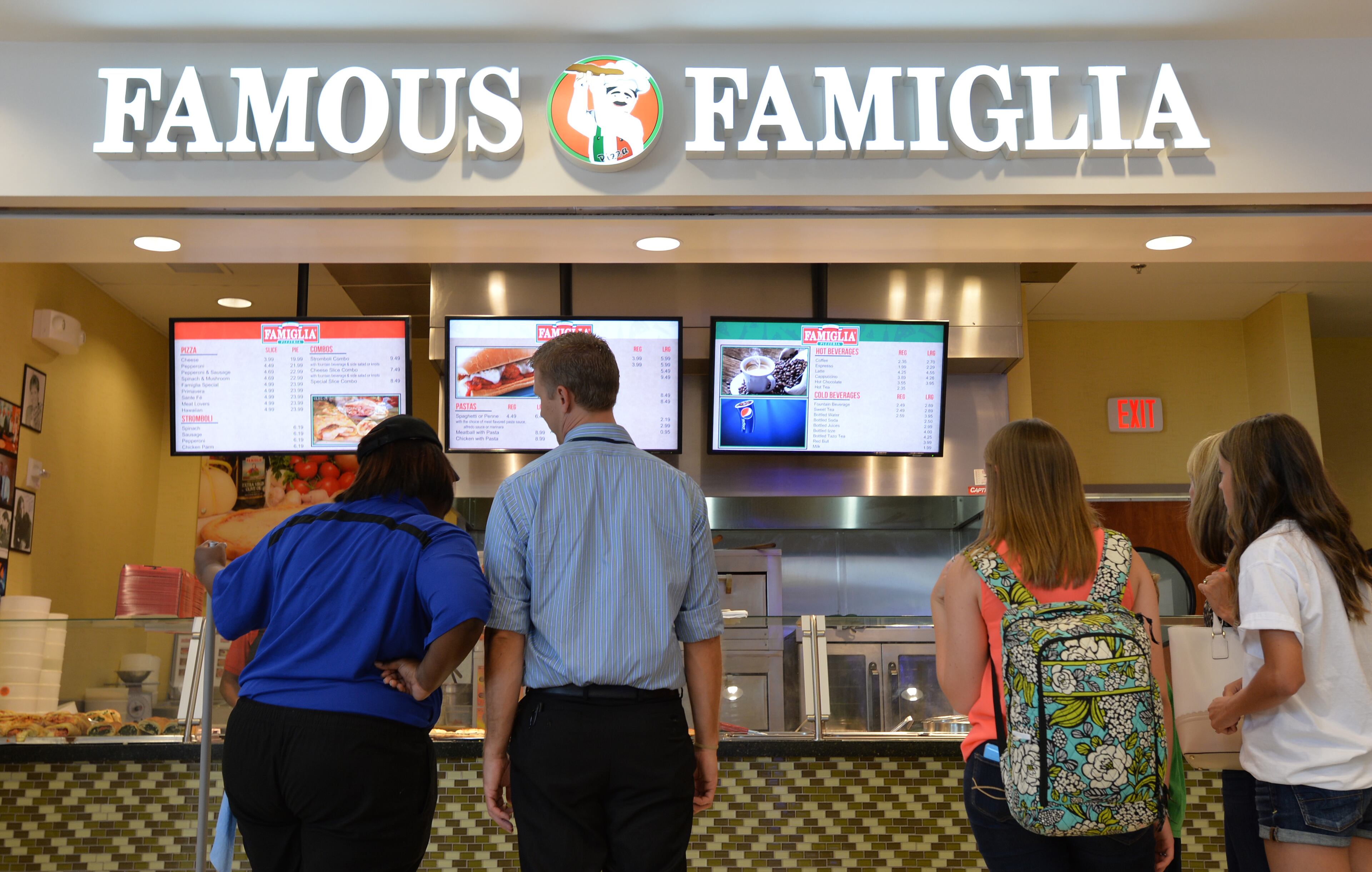June 24, 2014 Atlanta - Airport travelers at one of newer additions, Famous Famiglia, in Concourse D, Hartsfield-Jackson Atlanta International Airport on Tuesday, June 24, 2014. Hartsfield-Jackson and Delaware North celebrate the newest additions to Concourse D, including local favorites GrindHouse Killer Burgers and Yoforia, and national brands 40/40 Club and Food Network Kitchen. HYOSUB SHIN / HSHIN@AJC.COM