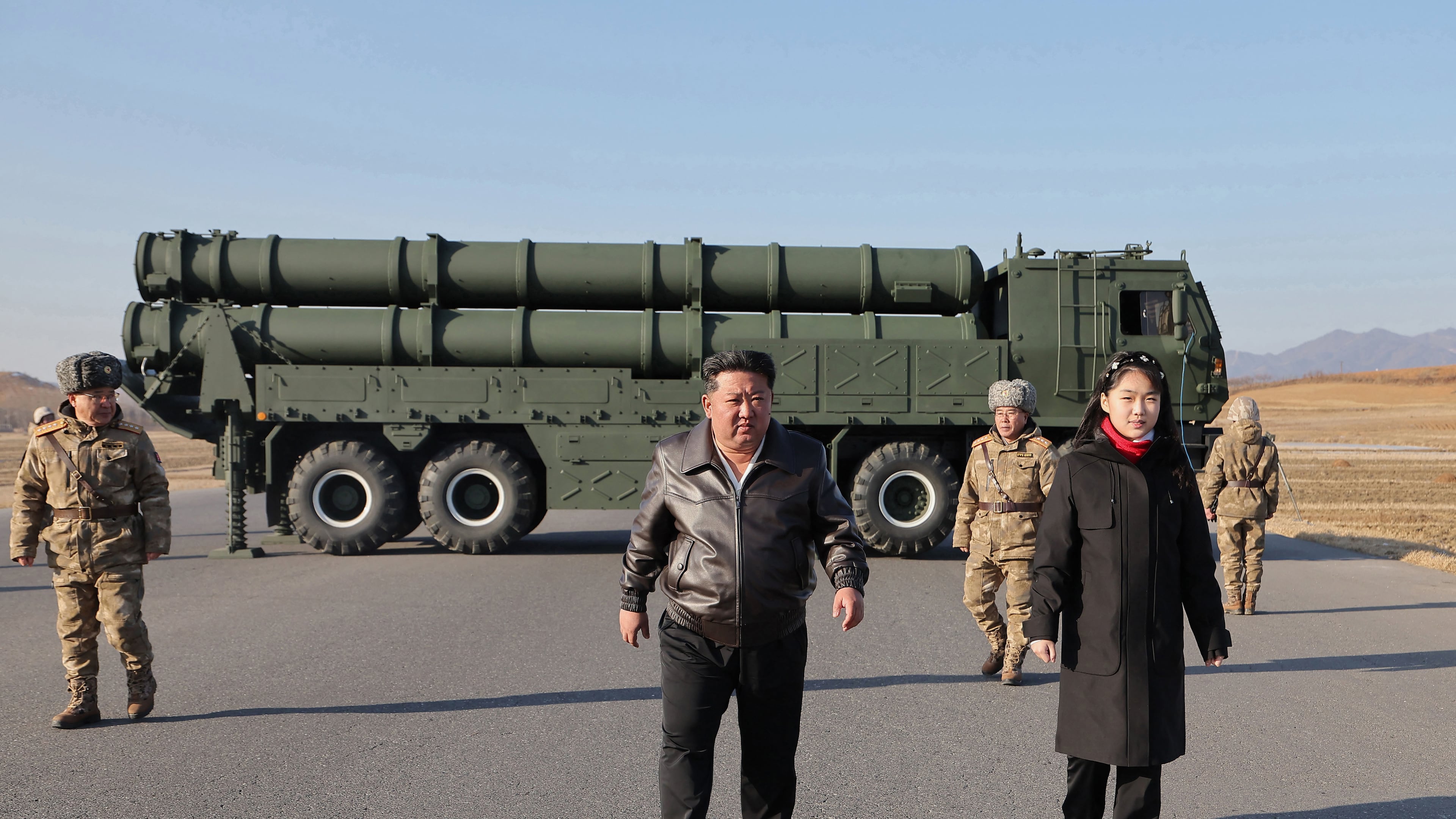 In this photo provided by the North Korean government, its leader Kim Jong Un, with his daughter, believed to be named Kim Ju Ae, inspects test-firing of ballistic missiles from an undisclosed location in North Korea, Tuesday, Jan. 27, 2026. Independent journalists were not given access to cover the event depicted in this image distributed by the North Korean government. The content of this image is as provided and cannot be independently verified. Korean language watermark on image as provided by source reads: "KCNA" which is the abbreviation for Korean Central News Agency. (Korean Central News Agency/Korea News Service via AP)