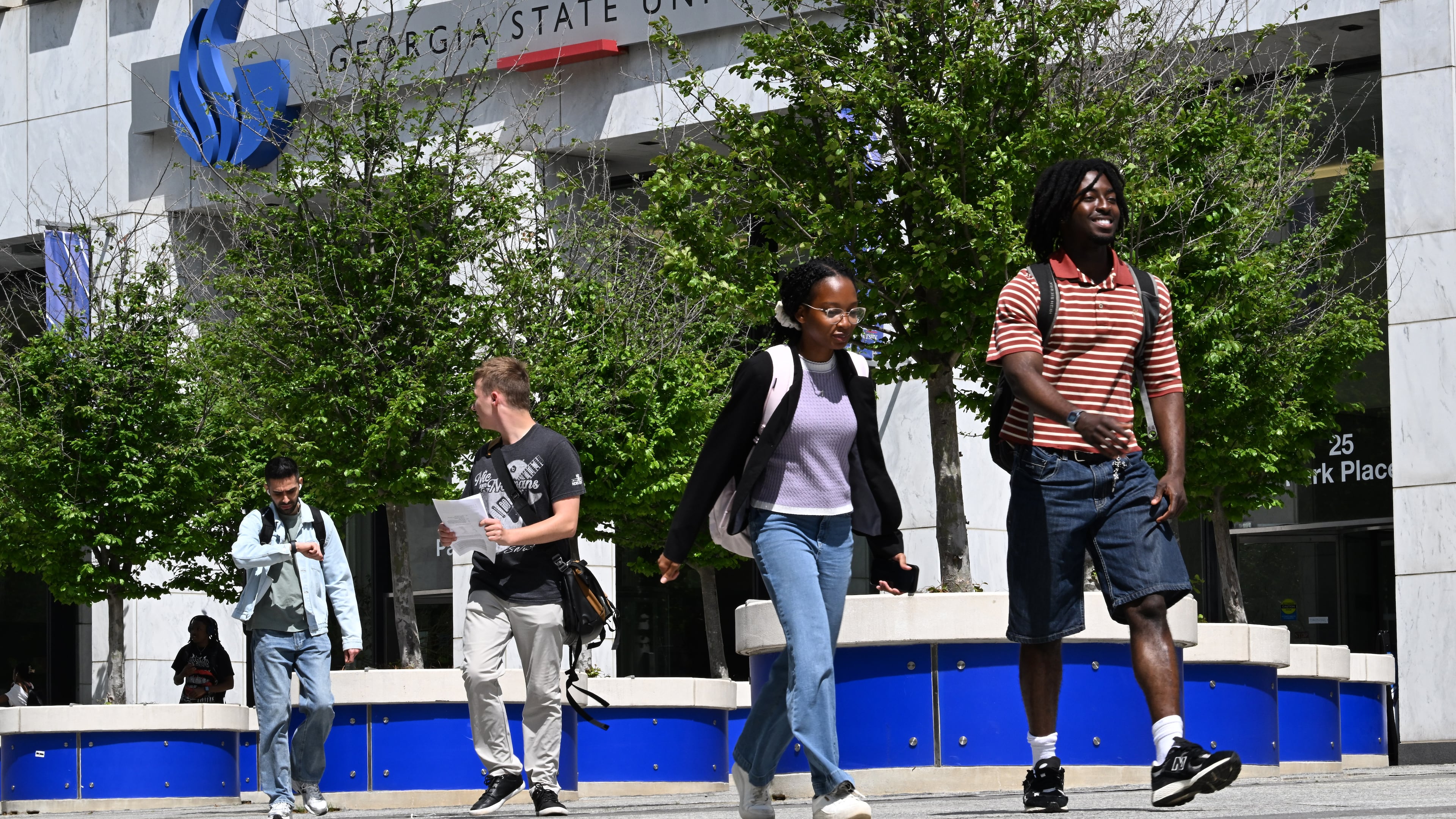 Students walk past Georgia State University’s 25 Park Place building Thursday, April 2, 2026, in Atlanta. (Hyosub Shin/AJC)