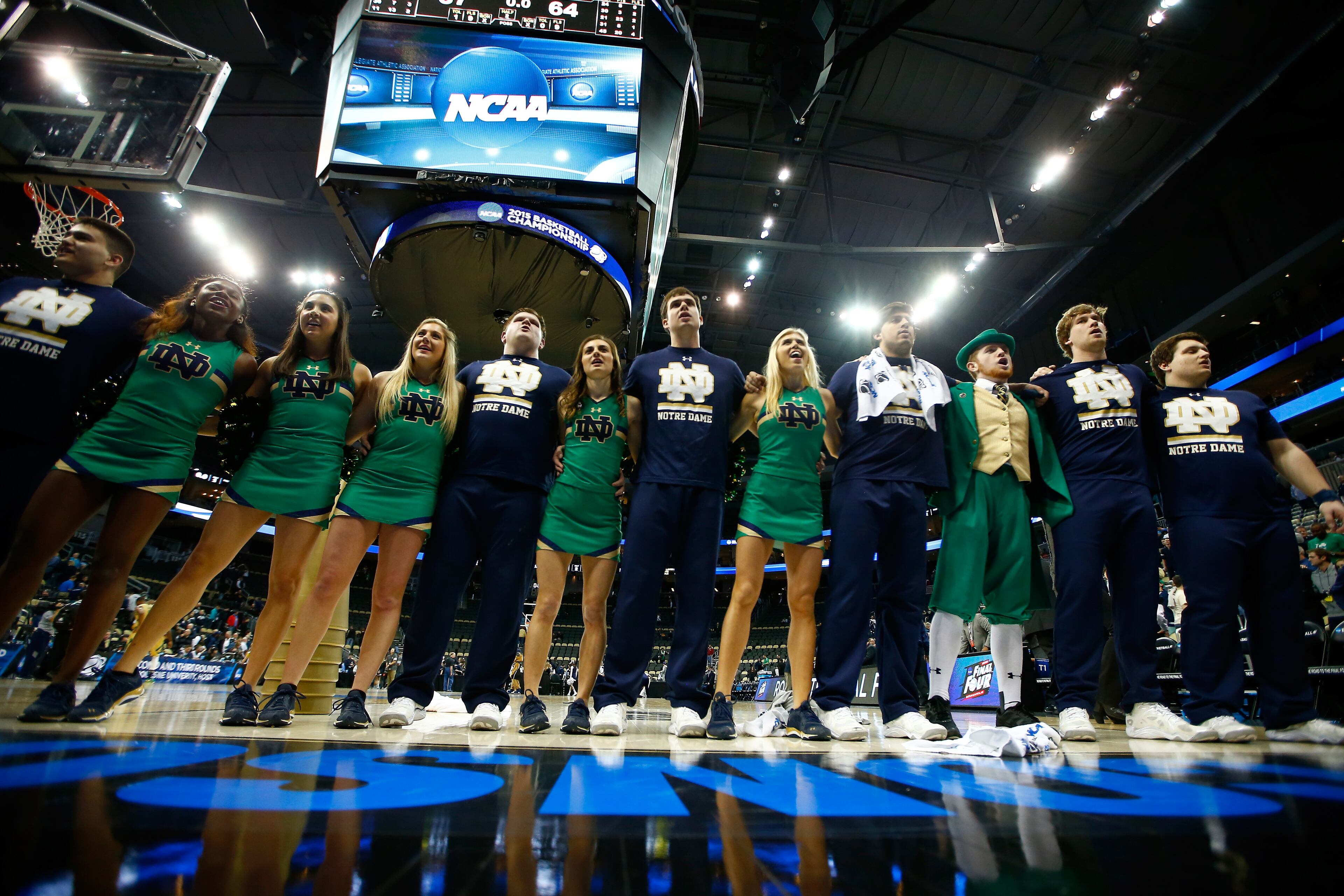 PITTSBURGH, PA - MARCH 21: Members of the Notre Dame Fighting Irish cheerleaders sing to the crowd following their 67-64 overtime win against the Butler Bulldogs during the third round of the 2015 NCAA Men's Basketball Tournament at Consol Energy Center on March 21, 2015 in Pittsburgh, Pennsylvania. (Photo by Jared Wickerham/Getty Images)