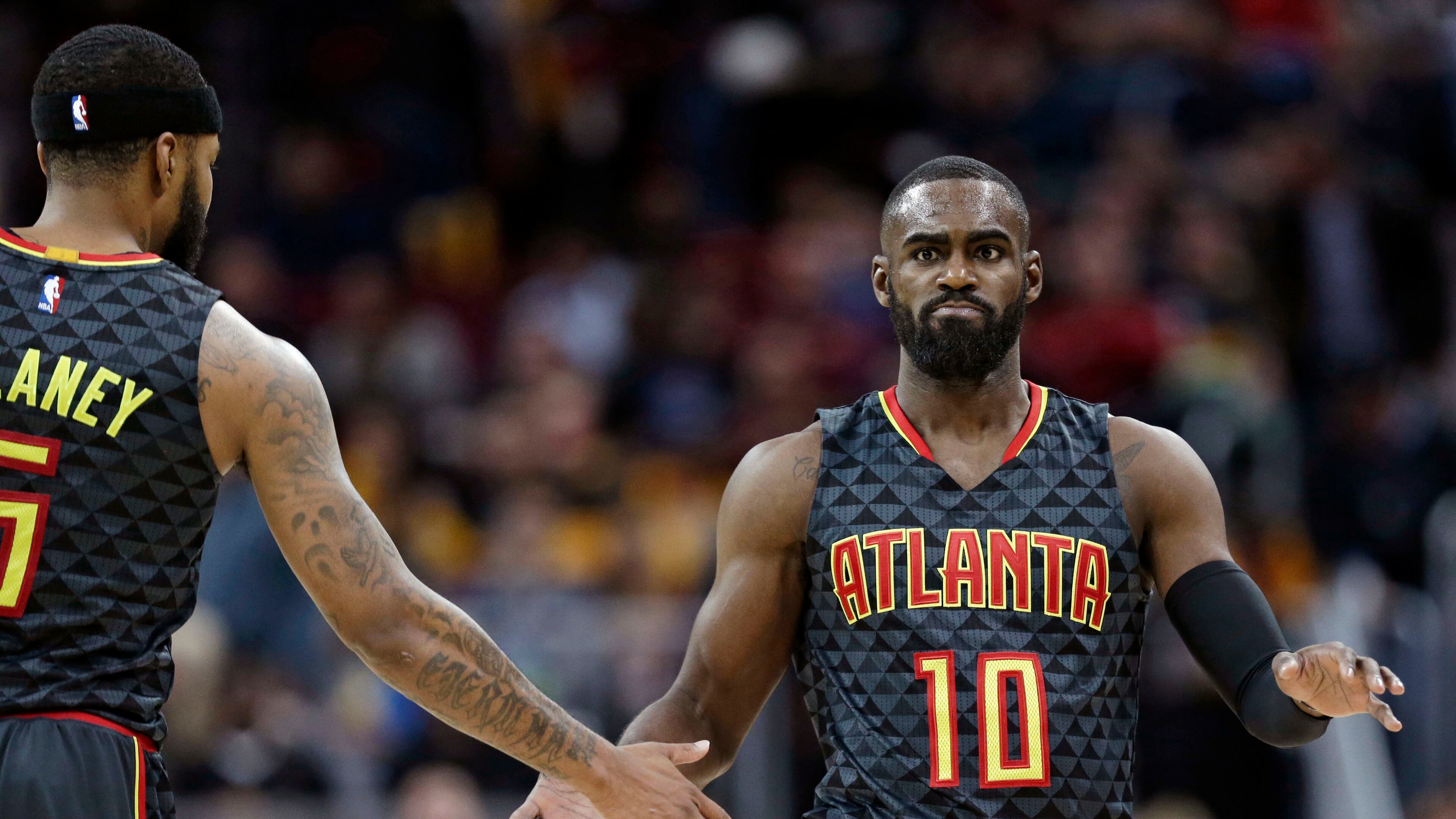 Atlanta Hawks’ Tim Hardaway Jr., right, is congratulated by Malcolm Delaney after shooting a3-point basket in the second half of an NBA basketball game against the Cleveland Cavaliers, Friday, April 7, 2017, in Cleveland. (AP Photo/Tony Dejak)