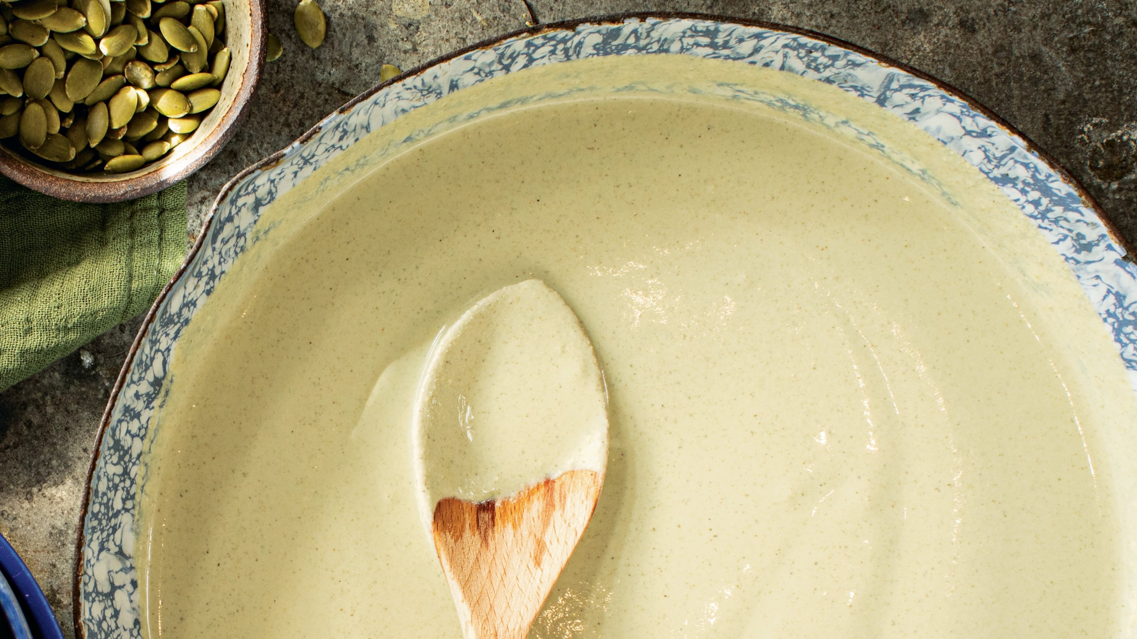 Pumpkin seeds are toasted before blending with spices to create a rich sauce.