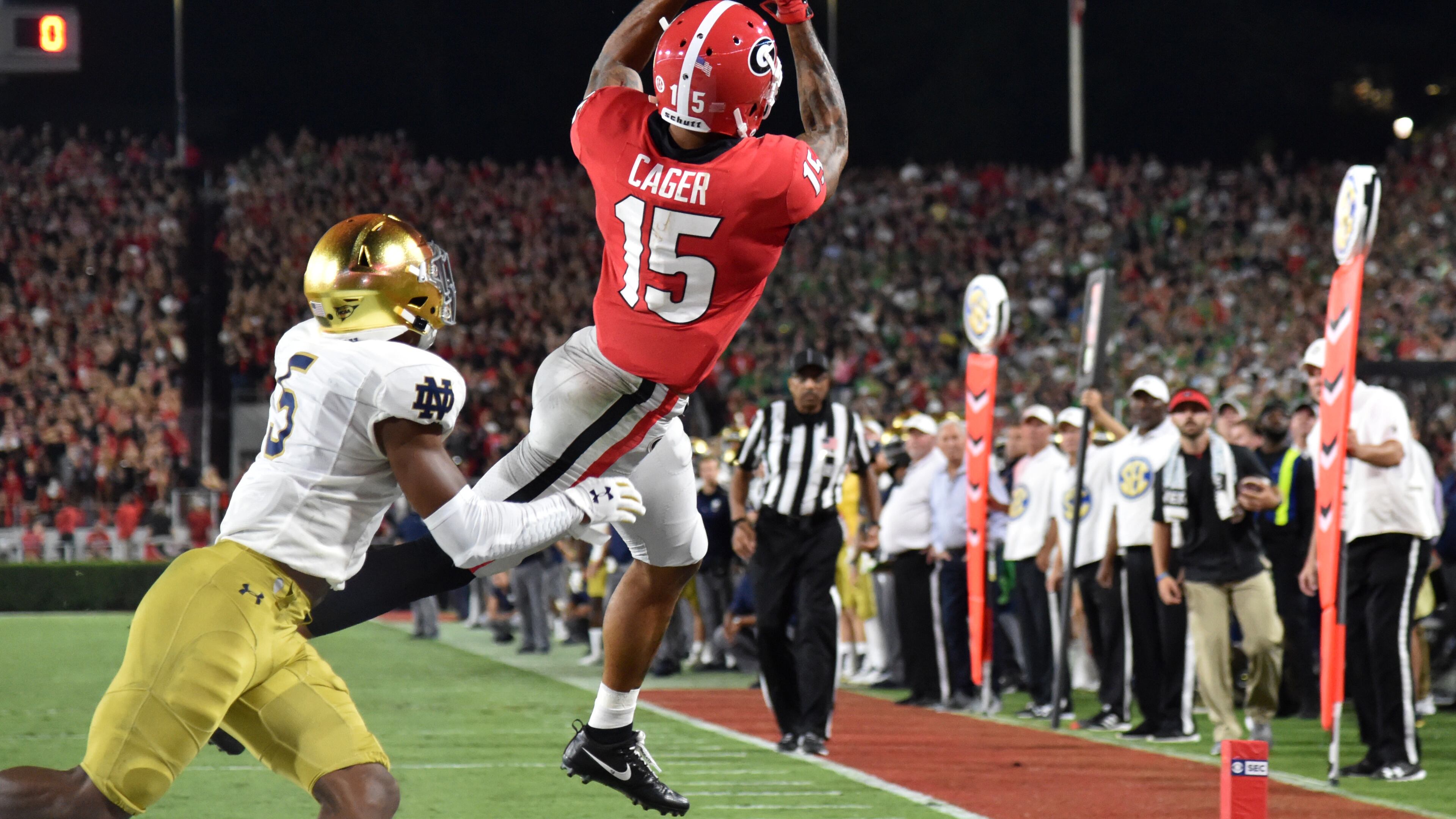 September 21, 2019 Athens - Georgia wide receiver Lawrence Cager (15) makes a touchdown pass over Notre Dame cornerback Troy Pride Jr. (5) in the second half in a NCAA college football at Sanford Stadium in Athens on Saturday, September 21, 2019. Georgia defeated Notre Dame 23-17. (Hyosub Shin / Hyosub.Shin@ajc.com)