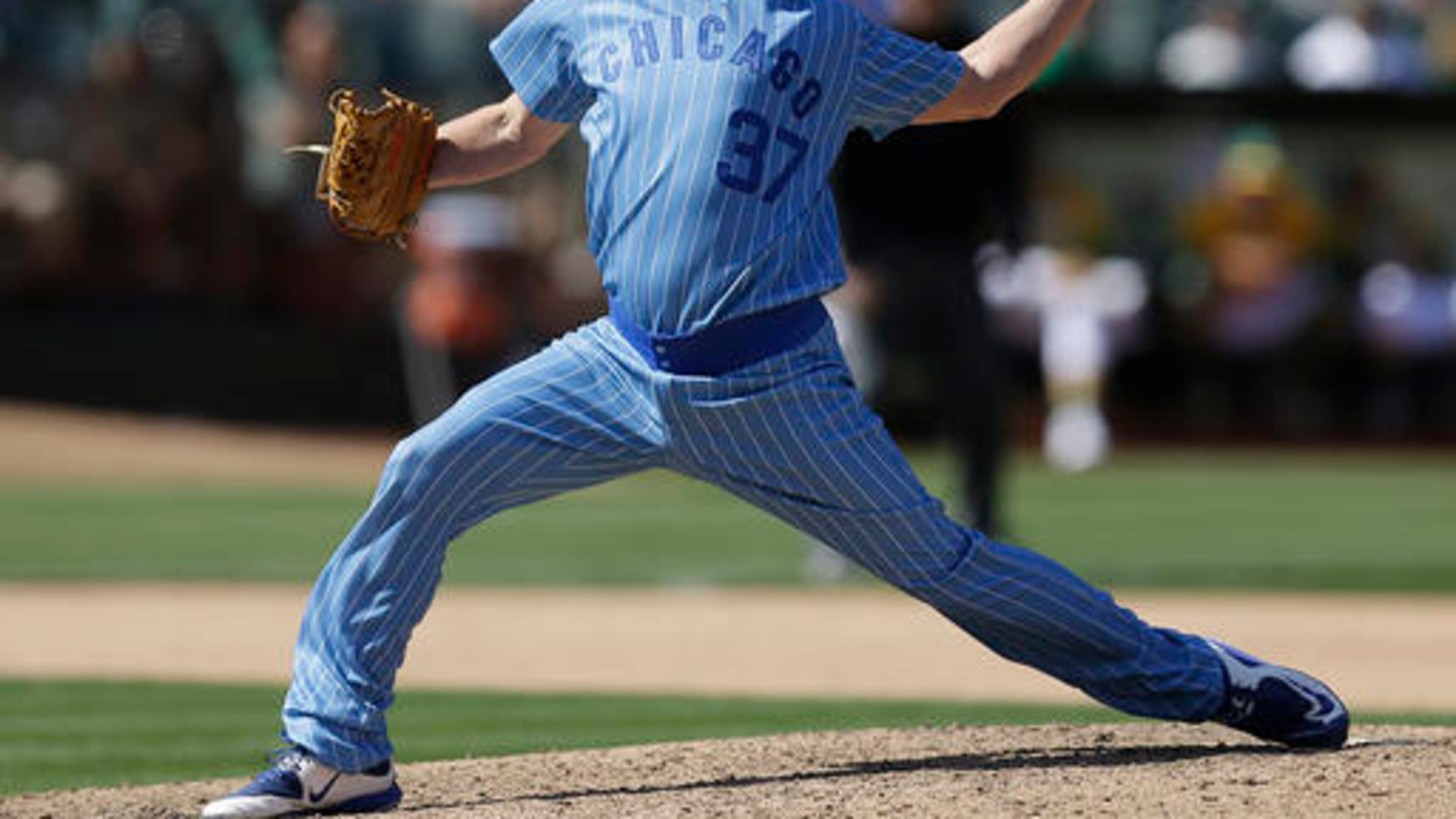 Chicago Cubs pitcher Travis Wood works against the Oakland Athletics in the ninth inning of a baseball game Saturday, Aug. 6, 2016, in Oakland, Calif. (AP Photo/Ben Margot)