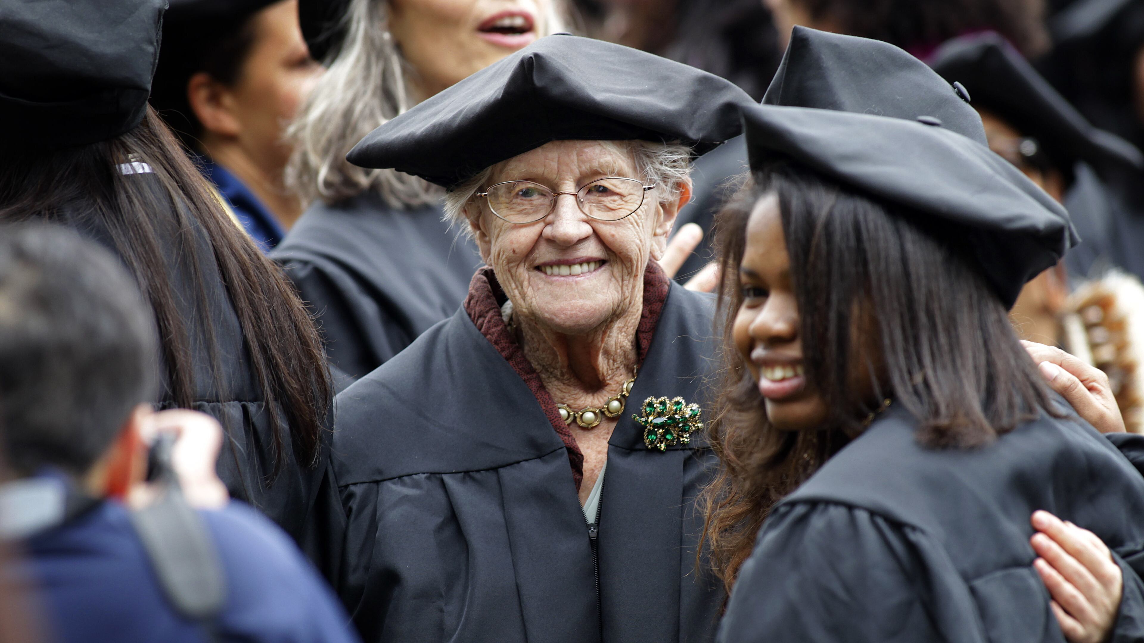 FILE - Hazel Soares, 94, center, gets her picture taken with some of her classmates before the start of commencement exercises at Mills College, in Oakland, Calif., Saturday, May 15, 2010. ( AP Photo/Tony Avelar, File)