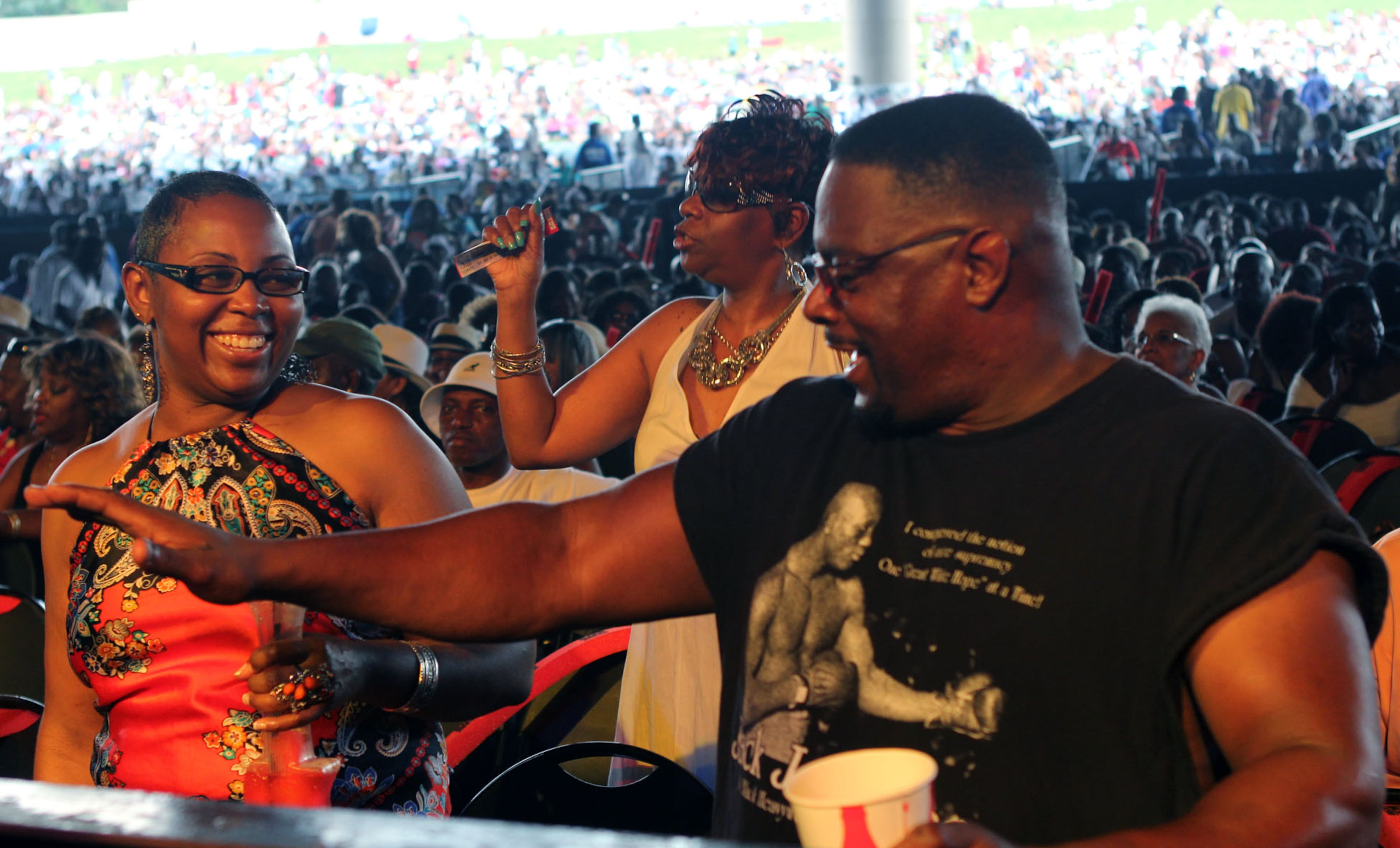 LawWanda Revere and Thomas Chandler jam to the music of Brick during the 2013 Flashback Festival at Aaron's Amphitheatre at Lakewood in Atlanta on Saturday.