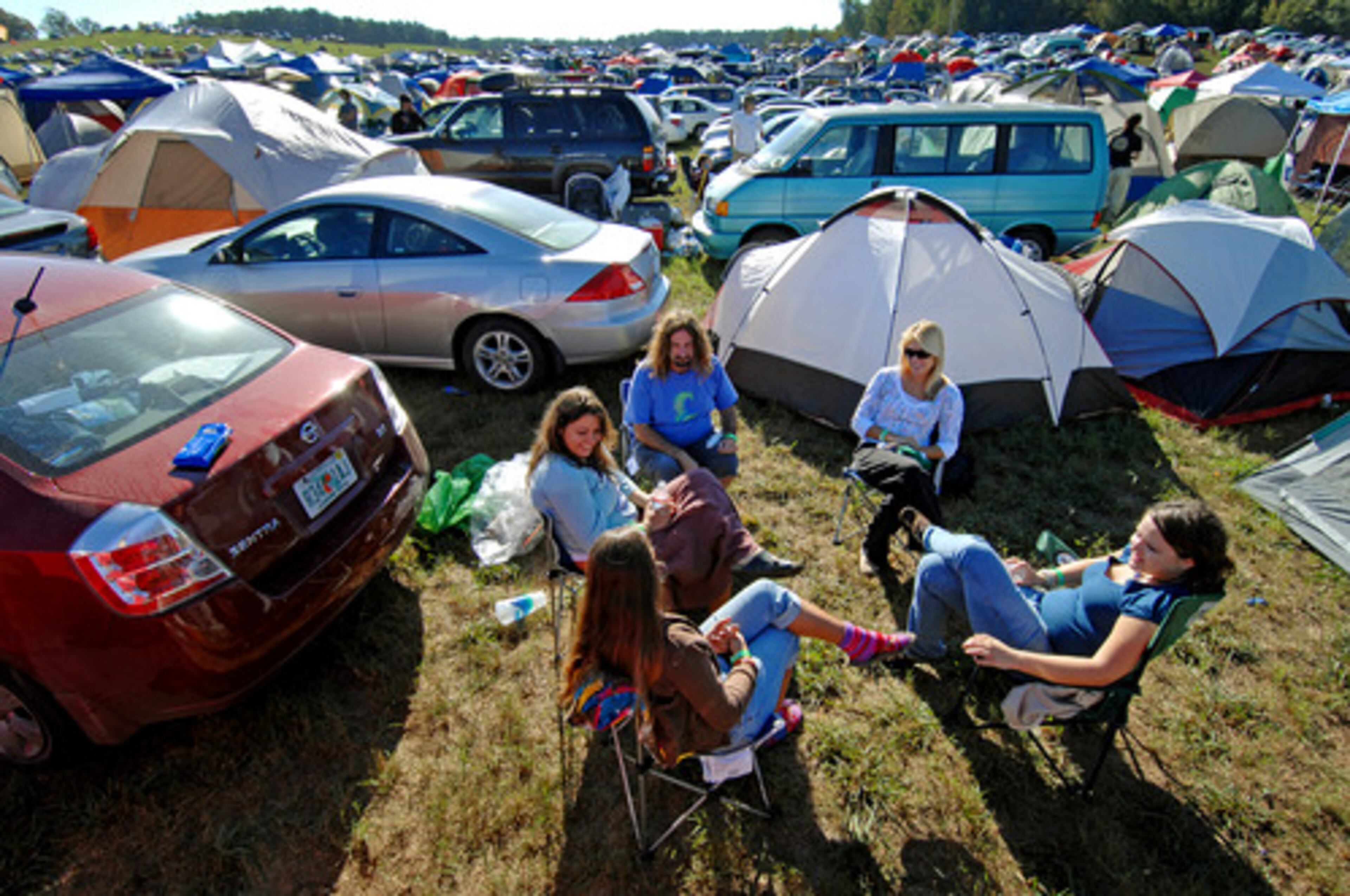 Hundreds descended on a private south Fulton farm for the three-day Echo Project fest. A group of music fans from Florida join the mix as they relax in the camping area Thursday morning.