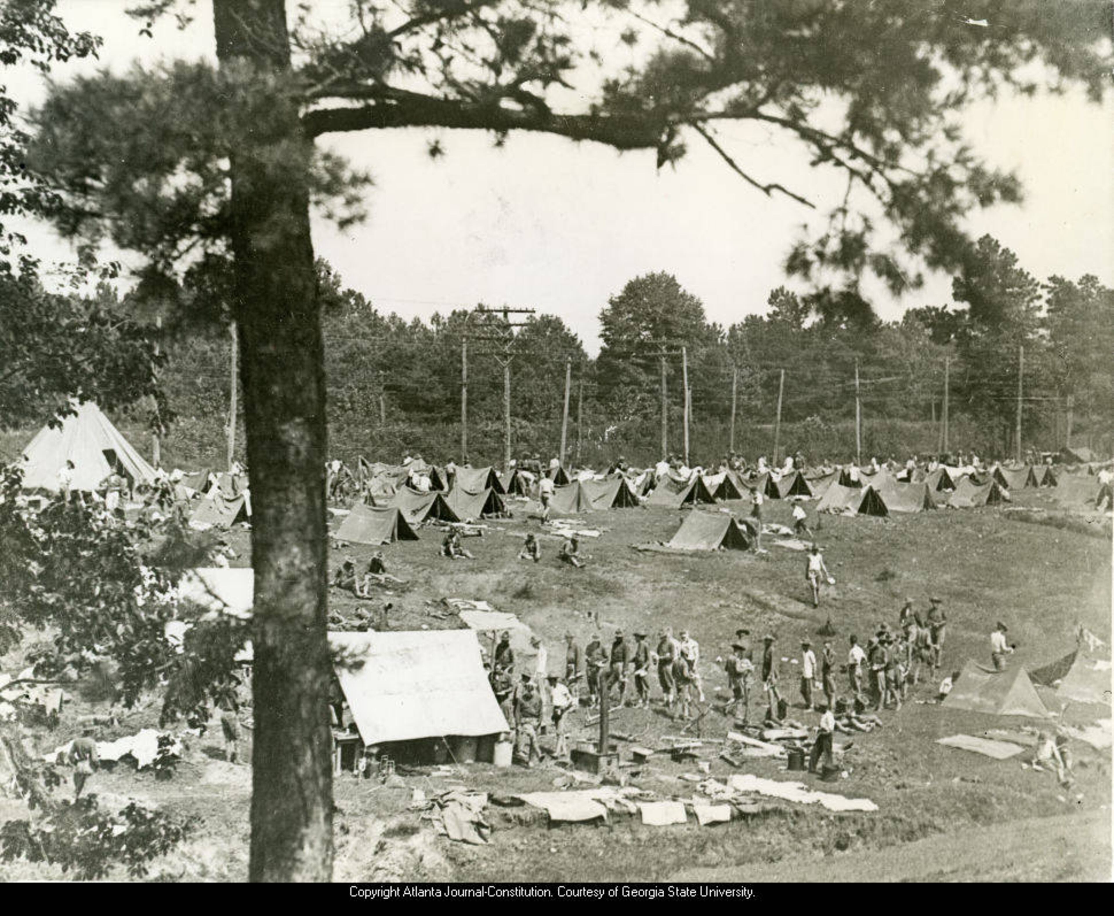 1940s -- Student officers at Fort McPherson, Ga. went on a nine-day hike as a last test before receiving commissions. This hike was made under terrible conditions, as it rained practically every day. This photo was taken by Tracy Mathewson, an Atlanta Constitution photographer who shot photos in and around Atlanta of recruits, soldiers, parades and training as far back as World War I.
