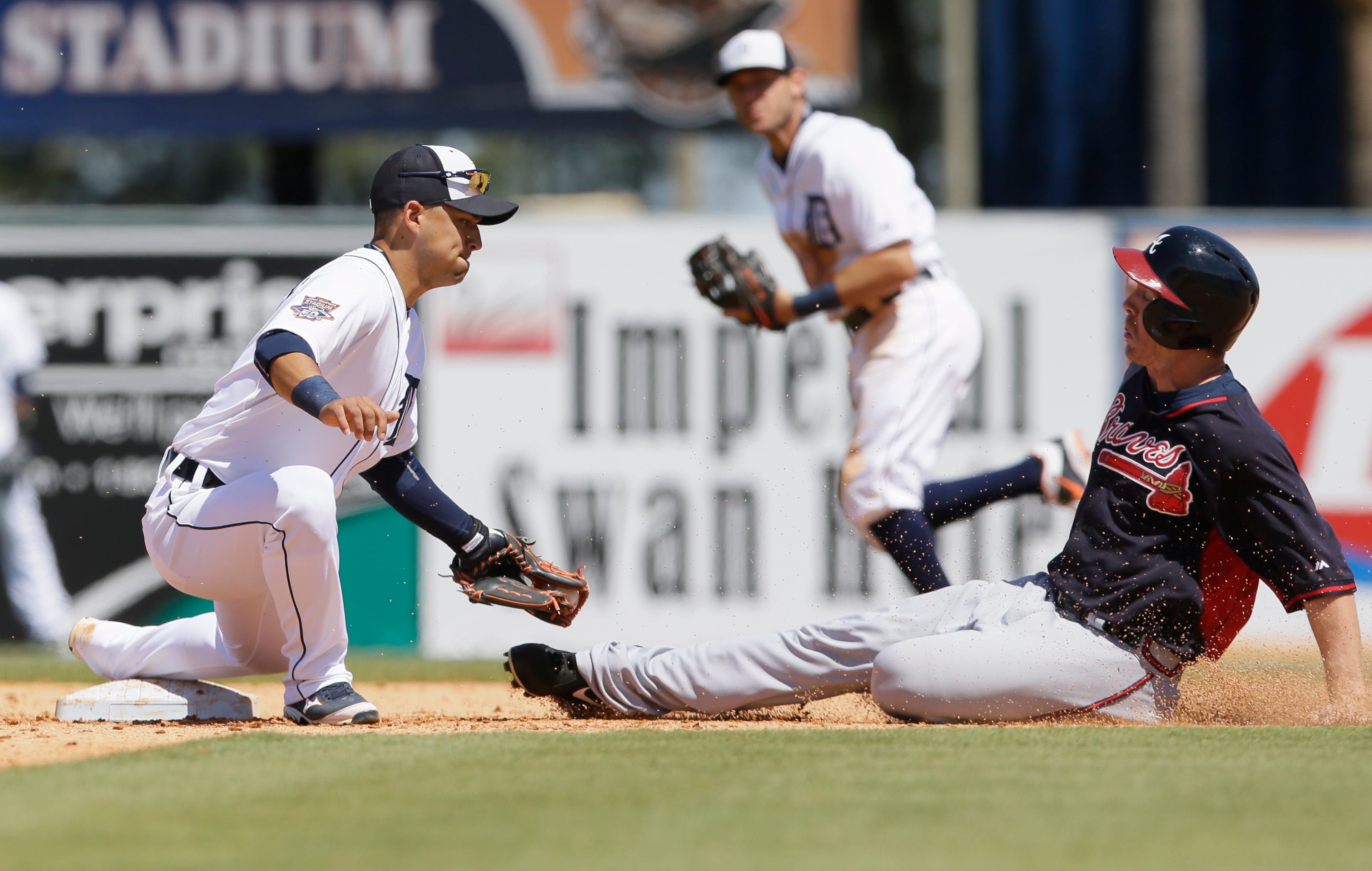 Atlanta Braves' Joe Benson is caught stealing second by Detroit Tigers shortstop Jose Iglesias during the sixth inning of a spring training exhibition baseball game in Lakeland, Fla., Monday, March 30, 2015. (AP Photo/Carlos Osorio)