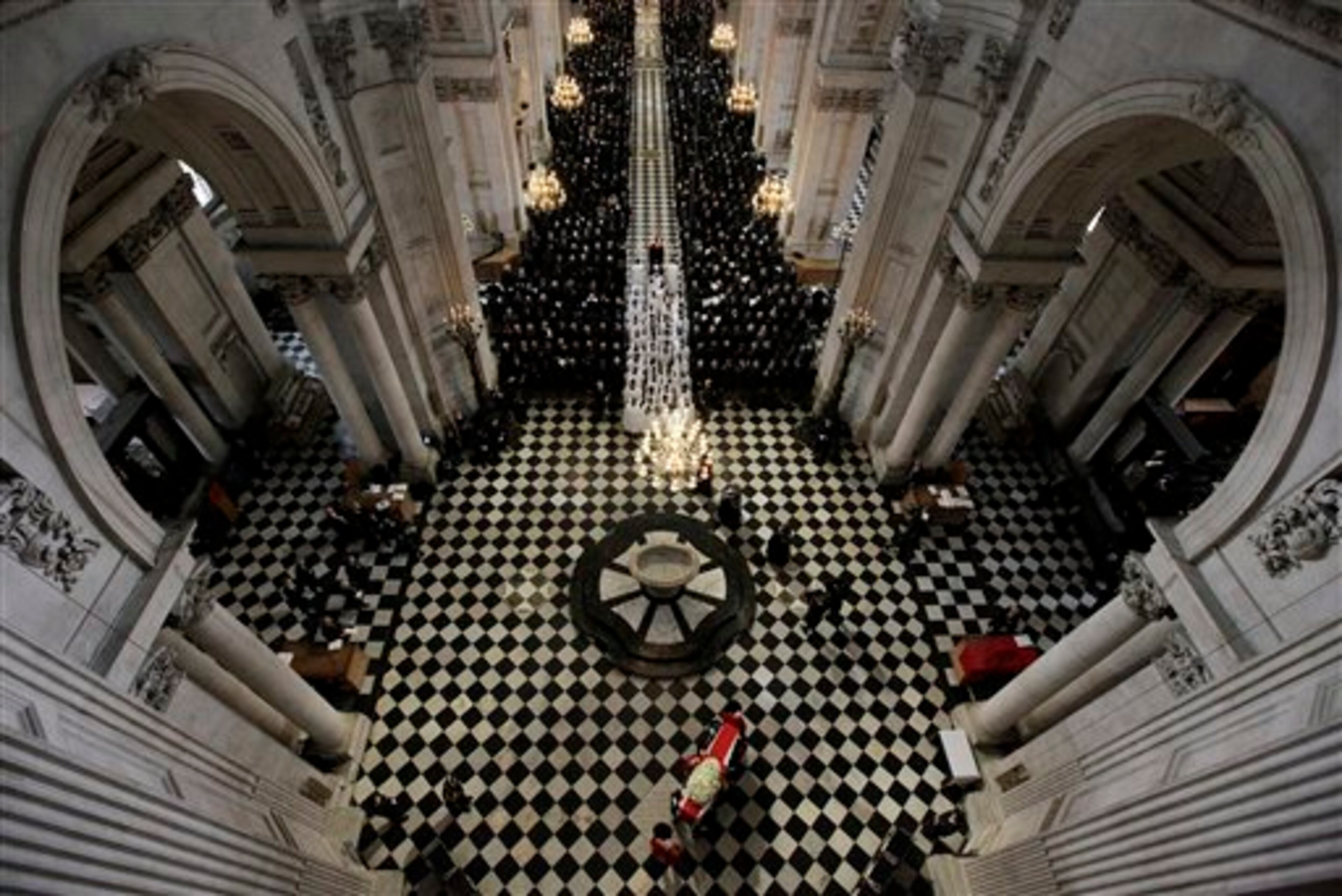 An overhead view shows the coffin containing the body of former British Prime Minister Margaret Thatcher arriving for the ceremonial funeral at St Paul's Cathedral in London, Wednesday April 17, 2013. World leaders and dignitaries from 170 countries are due to attend the funeral of former British Prime Minister Margaret Thatcher on Wednesday, an elaborate affair with full military honors that will culminate in a service at St. Paul's Cathedral in London. (AP Photo/Stefan Wermuth, Pool)