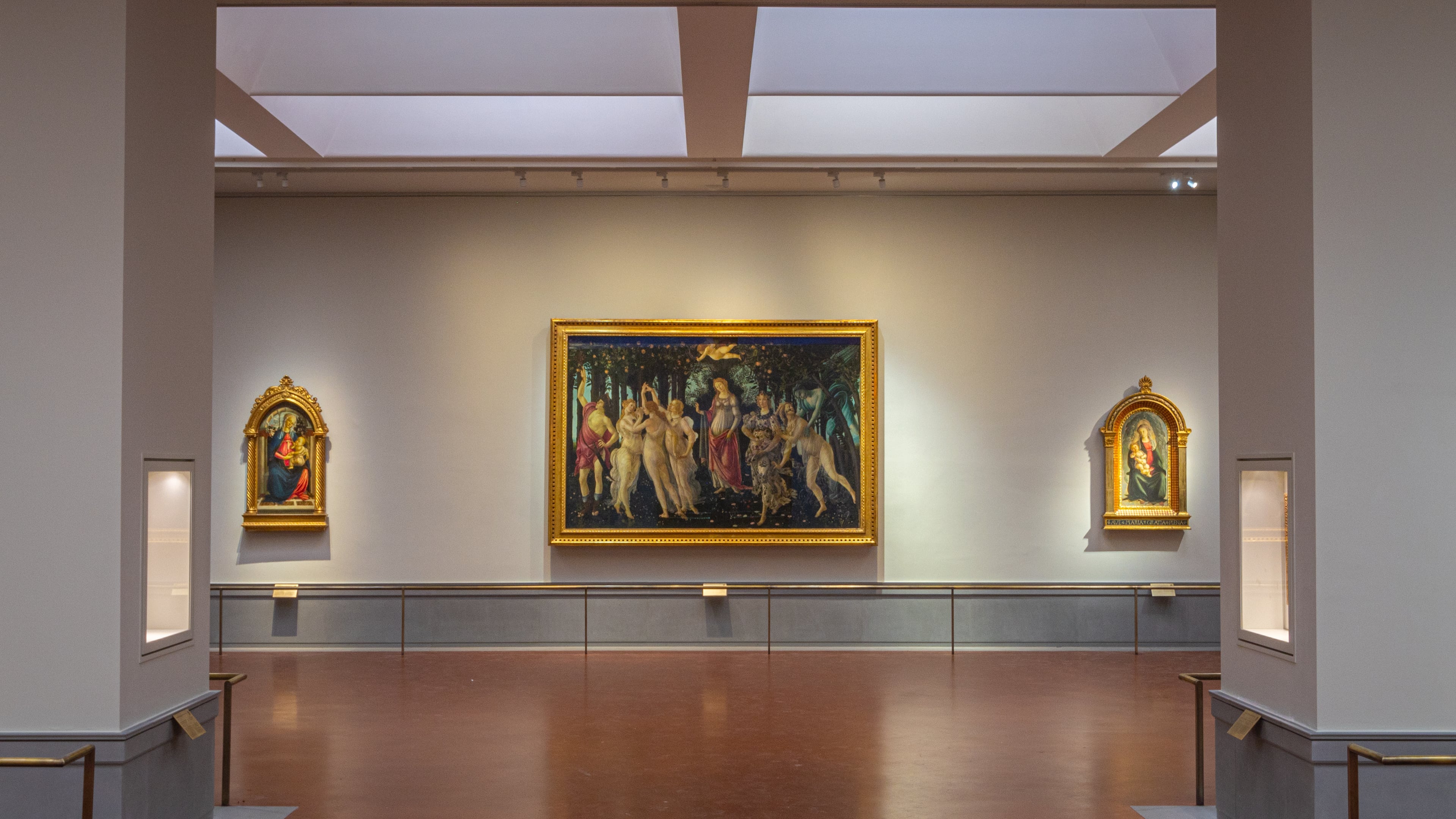 This picture made available Tuesday, June 16, 2026 shows a view of the renovated and refurbished Botticelli rooms, with Renaissance master Sandro Botticelli's paintings: "Spring ", center, "Madonna of the Rose Garden", left and "Madonna in glory with Seraphim" displayed at Florence's Uffizi Galleries, Italy. (Press Office of the Uffizi Gallery Museum via AP)