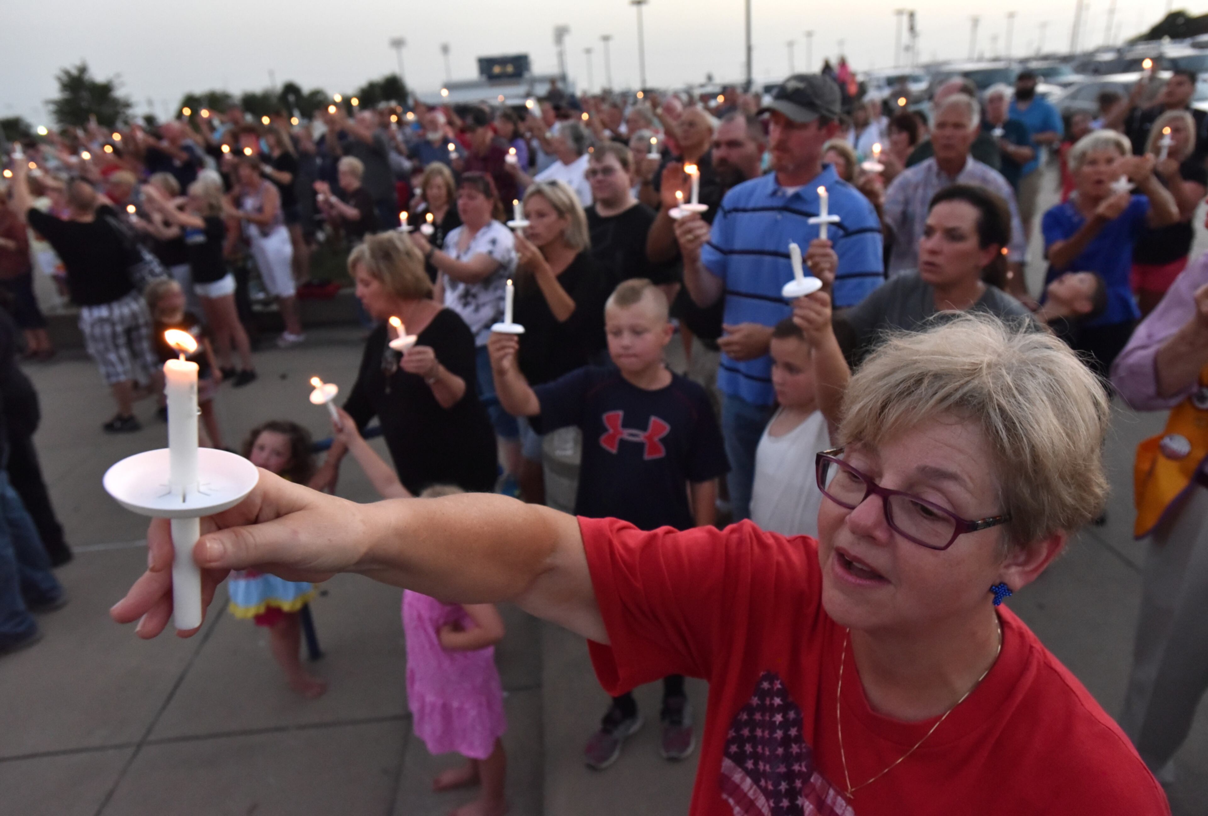 July 10, 2016 Corsicana, Texas - Hundreds gather for a candlelight vigil to honor Brent Thompson, the Dallas Area Rapid Transit officer killed in the Thursday night attack, at Corsicana High School in Corsicana on Sunday, July 10, 2016. Thompson was a Corsicana native, a graduate of Corsicana High and a former officer for both the city and Corsicana ISD. Thompson was the first of the five fallen officers in the Dallas shooting to be named. HYOSUB SHIN / HSHIN@AJC.COM