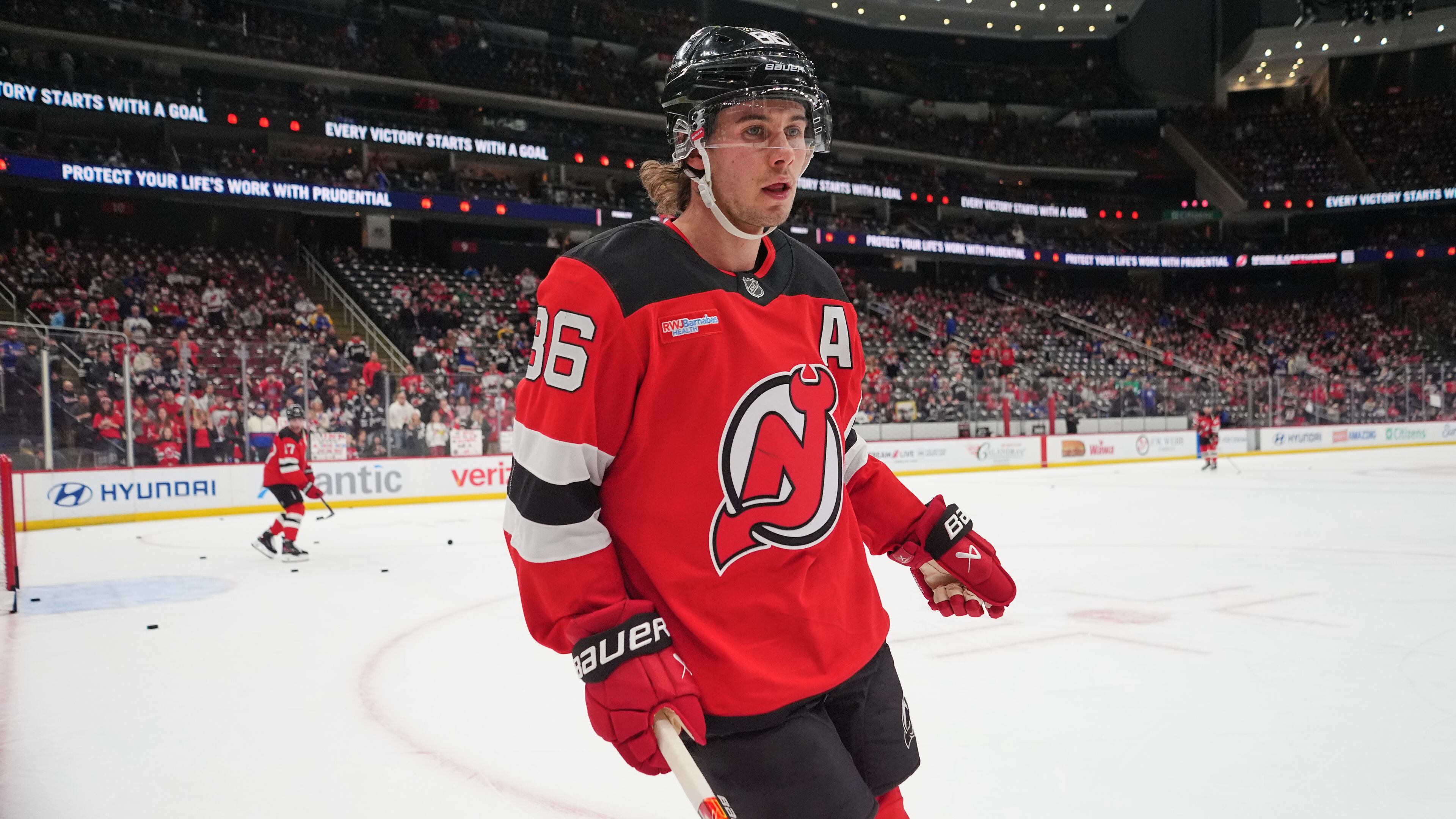 New Jersey Devils' Jack Hughes (86) leaves the ice before an NHL hockey game against the Buffalo Sabres Wednesday, Feb. 25, 2026, in Newark, N.J. (AP Photo/Frank Franklin II)