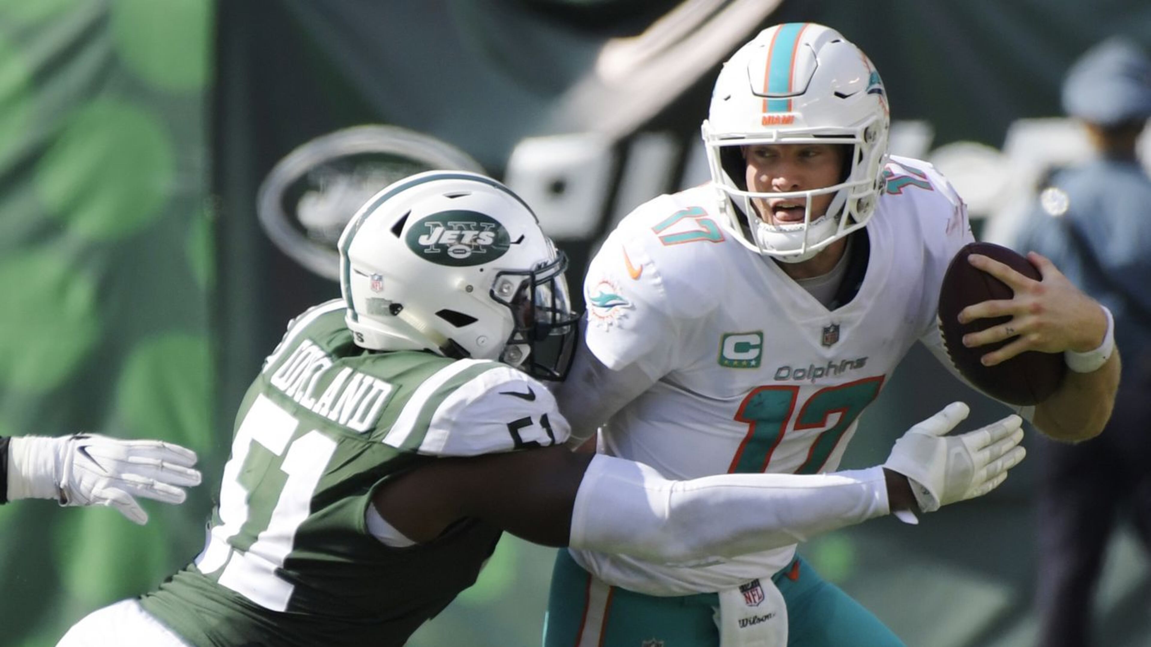Brandon Copeland, seen here sacking Dolphins quarterback Ryan Tannehill in Week 2, knows Jets need to be a consistent presence getting after the QB this season. (Bill Kostroun / AP)