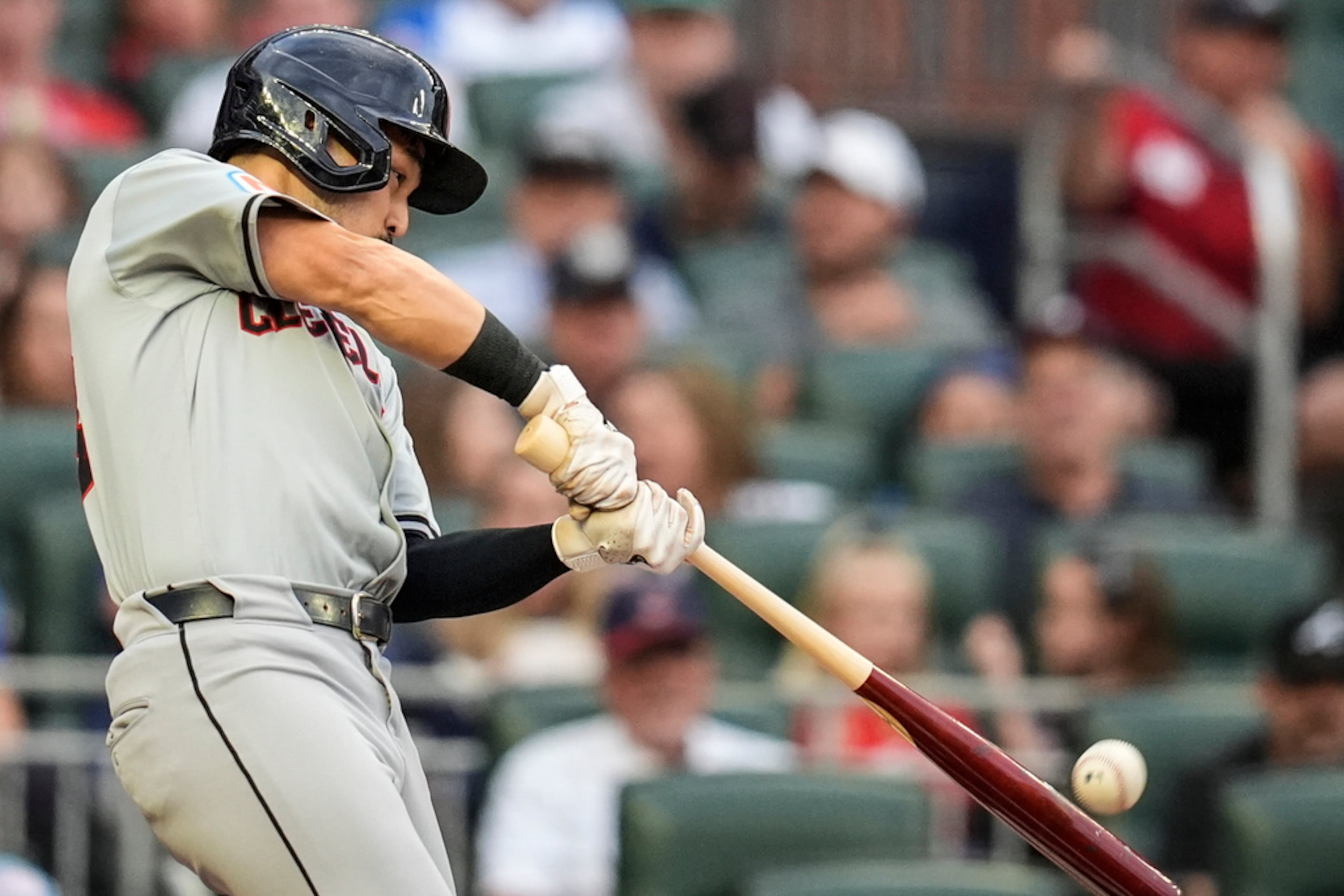 Cleveland Guardians outfielder Steven Kwan (38) hits a solo homer against the Atlanta Braves during the first inning of a baseball game, Friday, April 26, 2024, in Atlanta. (AP Photo/Mike Stewart)