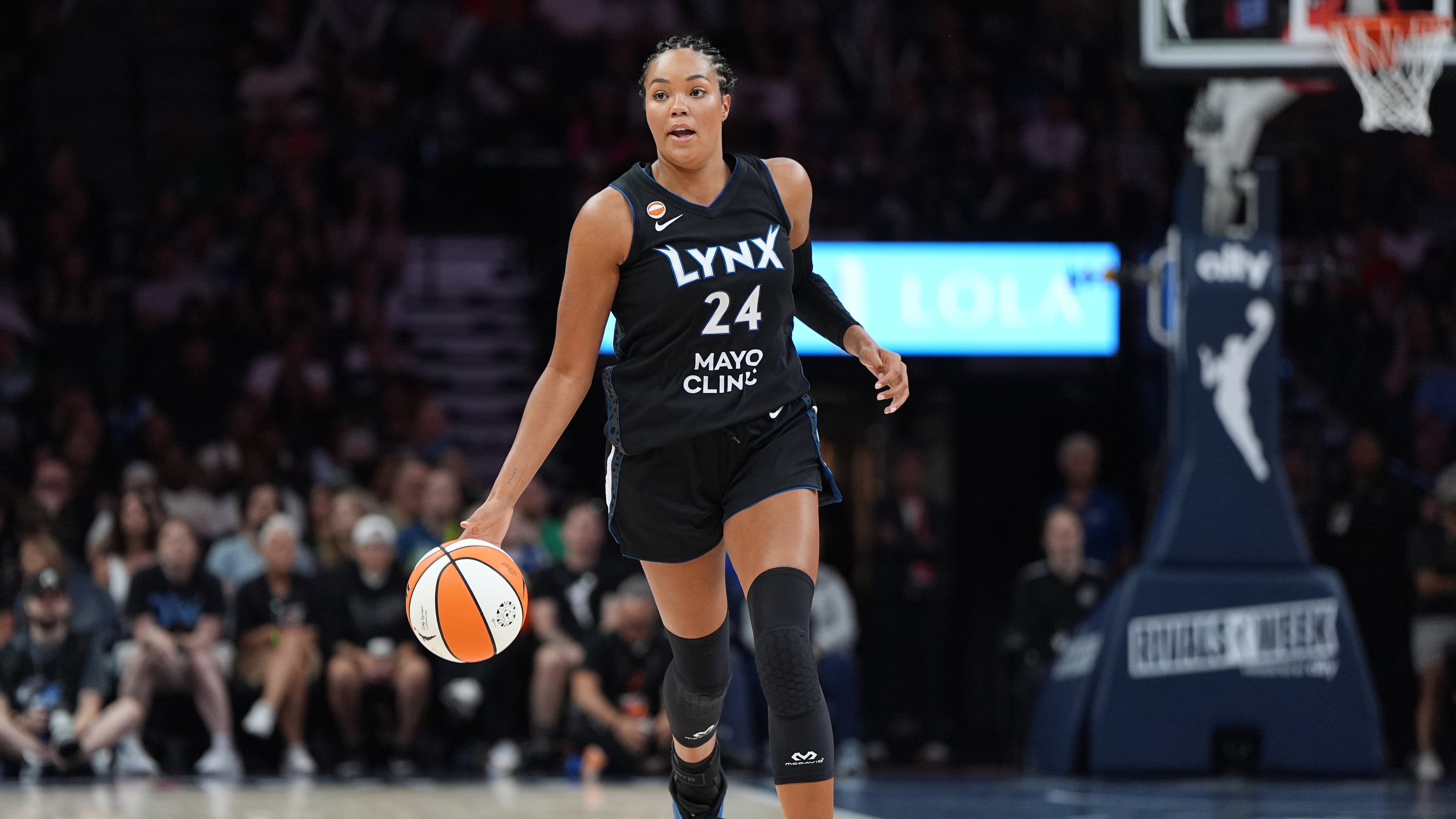 Minnesota Lynx forward Napheesa Collier dribbles down the court during the first half of a WNBA basketball game against the Las Vegas Aces in Minneapolis, Saturday, Aug. 8, 2026. (AP Photo/Abbie Parr)