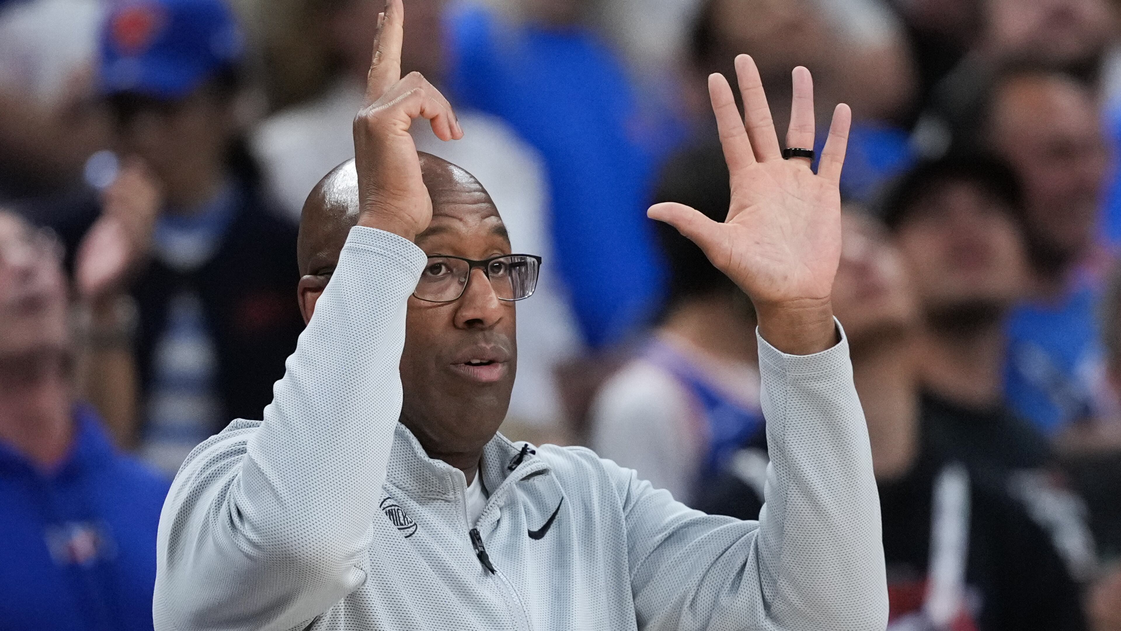 New York Knicks head coach Mike Brown makes a call during the first half of Game 2 of the NBA Finals basketball series against the San Antonio Spurs, Friday, June 5, 2026, in San Antonio. (AP Photo/Eric Gay)
