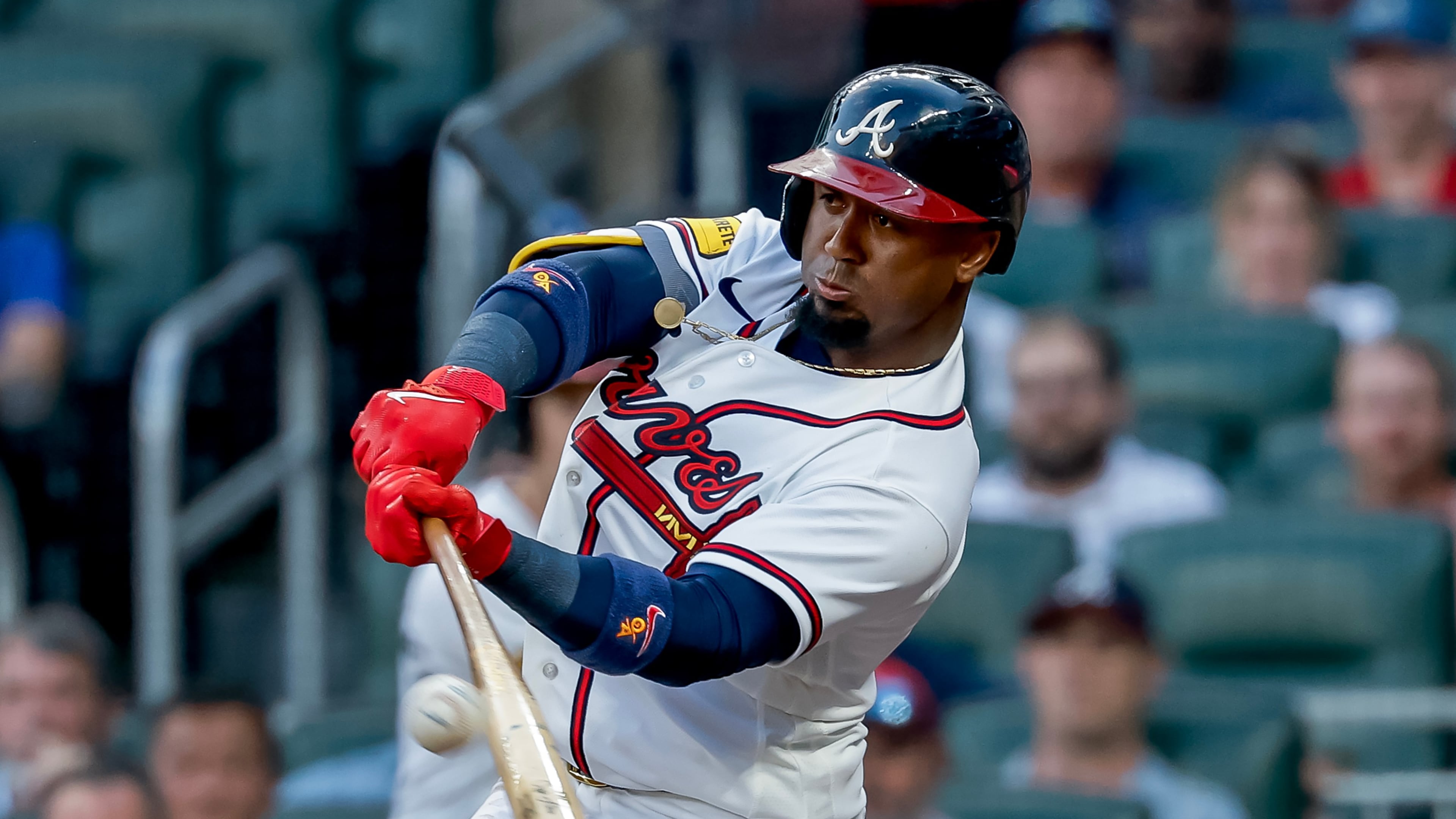 Atlanta Braves' Ozzie Albies (1) hits an RBI sacrifice fly against the Los Angeles Dodgers during the first inning of a baseball game, Tuesday, Aug. 25, 2026, in Atlanta. (AP Photo/Erik S. Lesser)