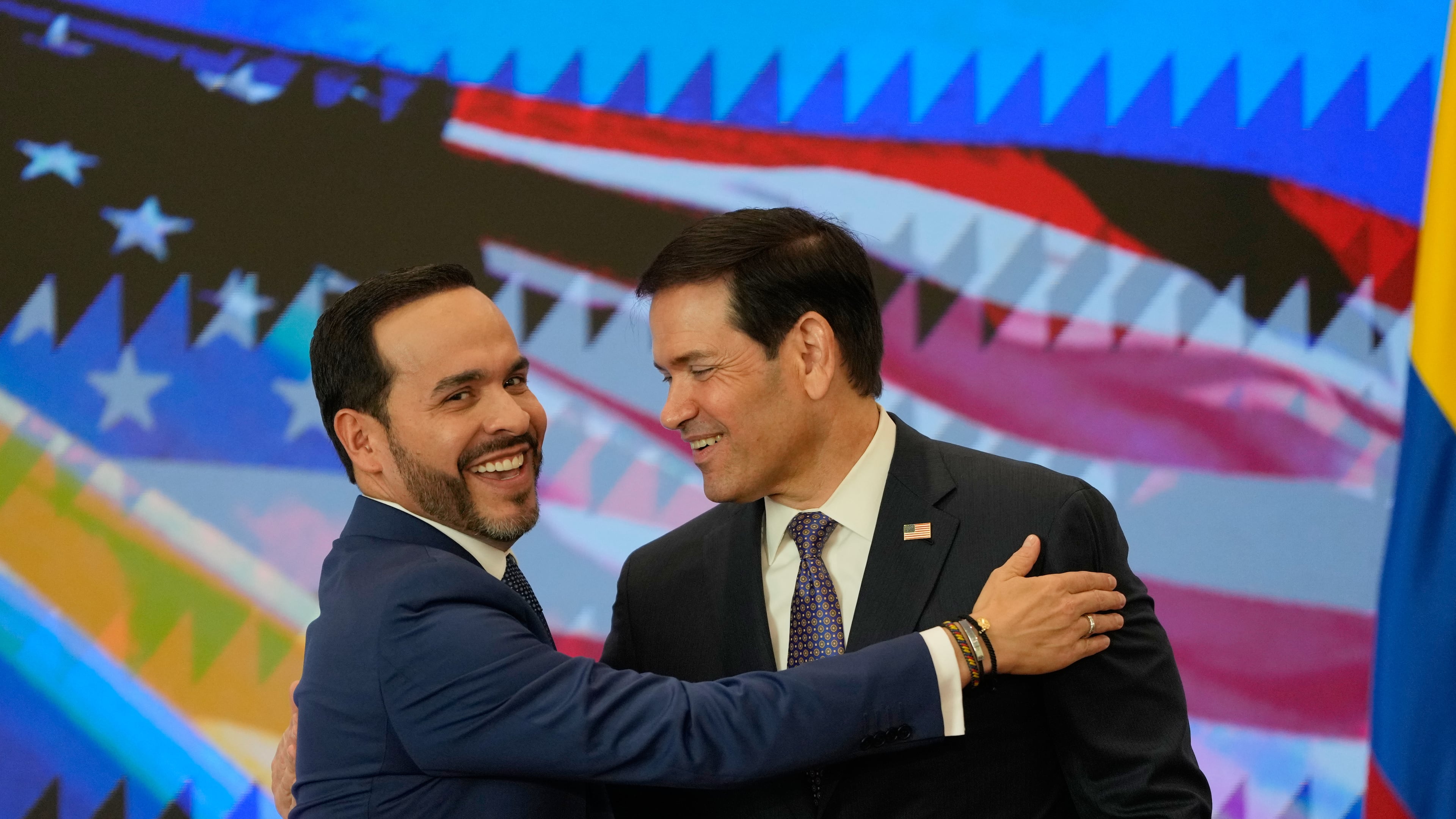 Colombian President Abelardo De La Espriella, left, and U.S. Secretary of State Marco Rubio embrace during a bilateral agreements signing ceremony in Barranquilla, Colombia, Tuesday, Sept. 8, 2026. (AP Photo/Fernando Vergara, Pool)