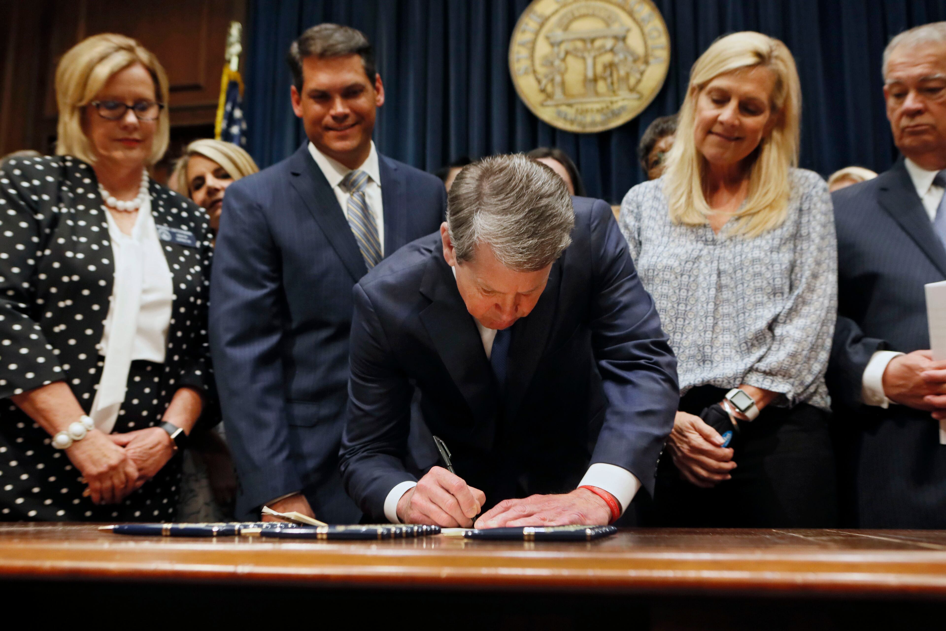 May 7, 2019 - Atlanta - Surrounded by supporters of the bill, including Sen. Renee Unterman (from left), R - Buford, Lt. Gov. Geoff Duncan, First Lady Marty Kemp, and House Speaker David Ralston, Gov. Brian Kemp signed HB 481, the "heartbeat bill", on Tuesday, setting the stage for a legal battle as the state attempts to outlaw most abortions after about six weeks of pregnancy. The bill, sponsored by Rep. Ed Setlzer, R-Acworth, and carried in the Senate by Sen. Renee Unterman, R - Buford, outlaws most abortions once a doctor can detect a fetus' heartbeat - usually around six weeks of pregnancy. Bob Andres / bandres@ajc.com