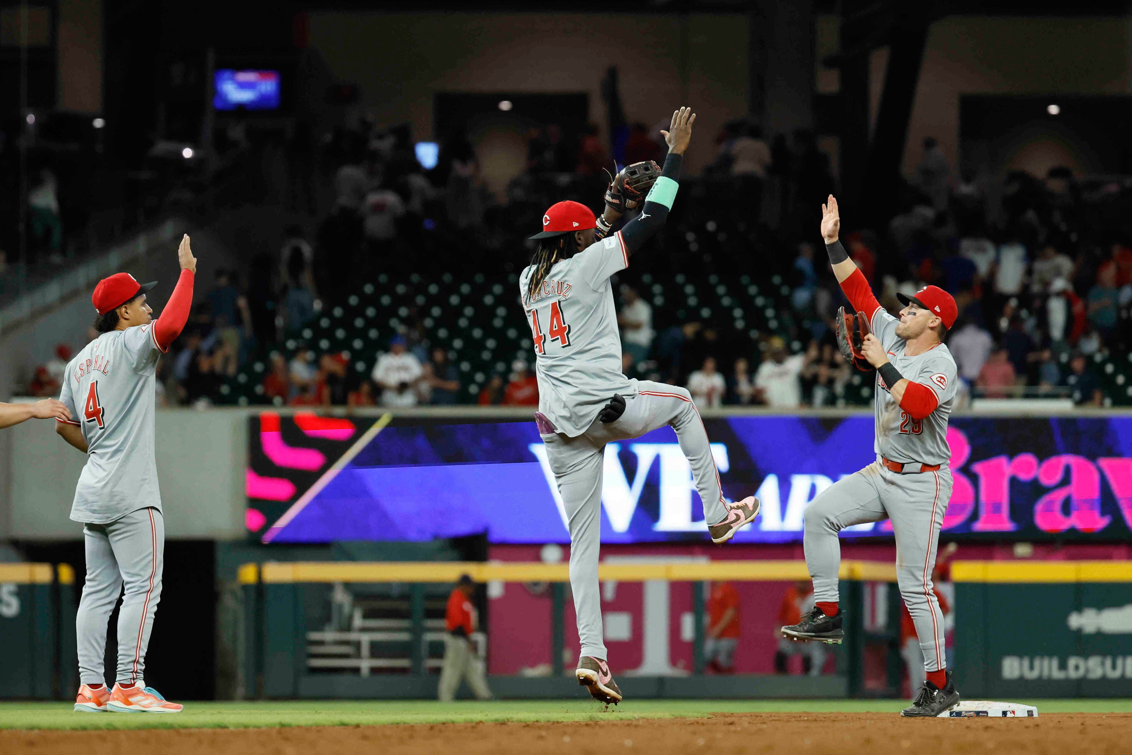 Celebration time for the Reds after their 1-0 victory over the Braves Monday.
(Miguel Martinez/ AJC)