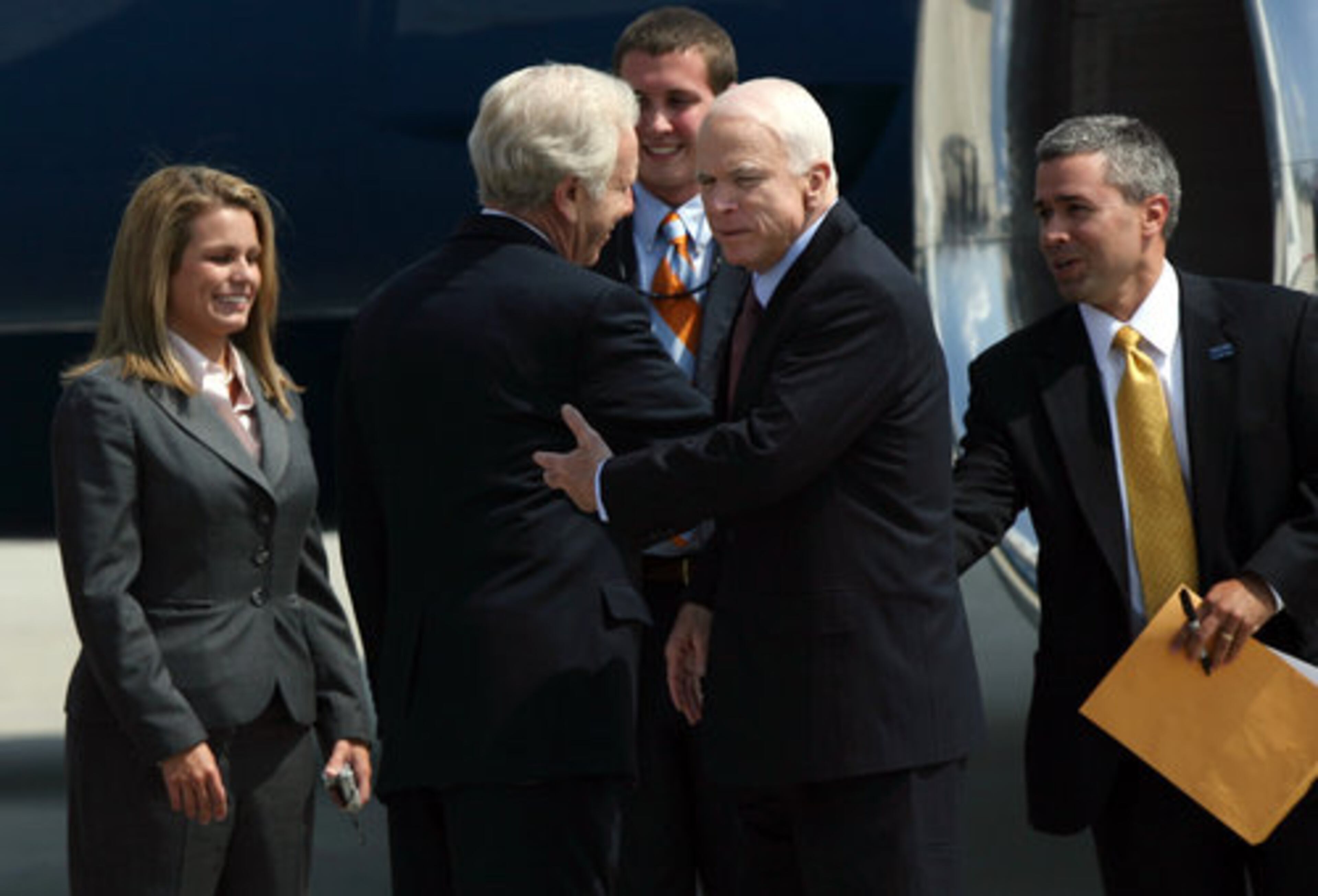 Sen. John McCain (right), the soon-to-be Republican presidential nominee, greet supporters as he arrives at Atlantic Aviation in Atlanta on August 18, 2008. McCain is in route to a fundraiser with the Republican National Commitee at the Marriott Marquis in downtown Atlanta. Jessica McGowan / jmcgowan@ajc.com