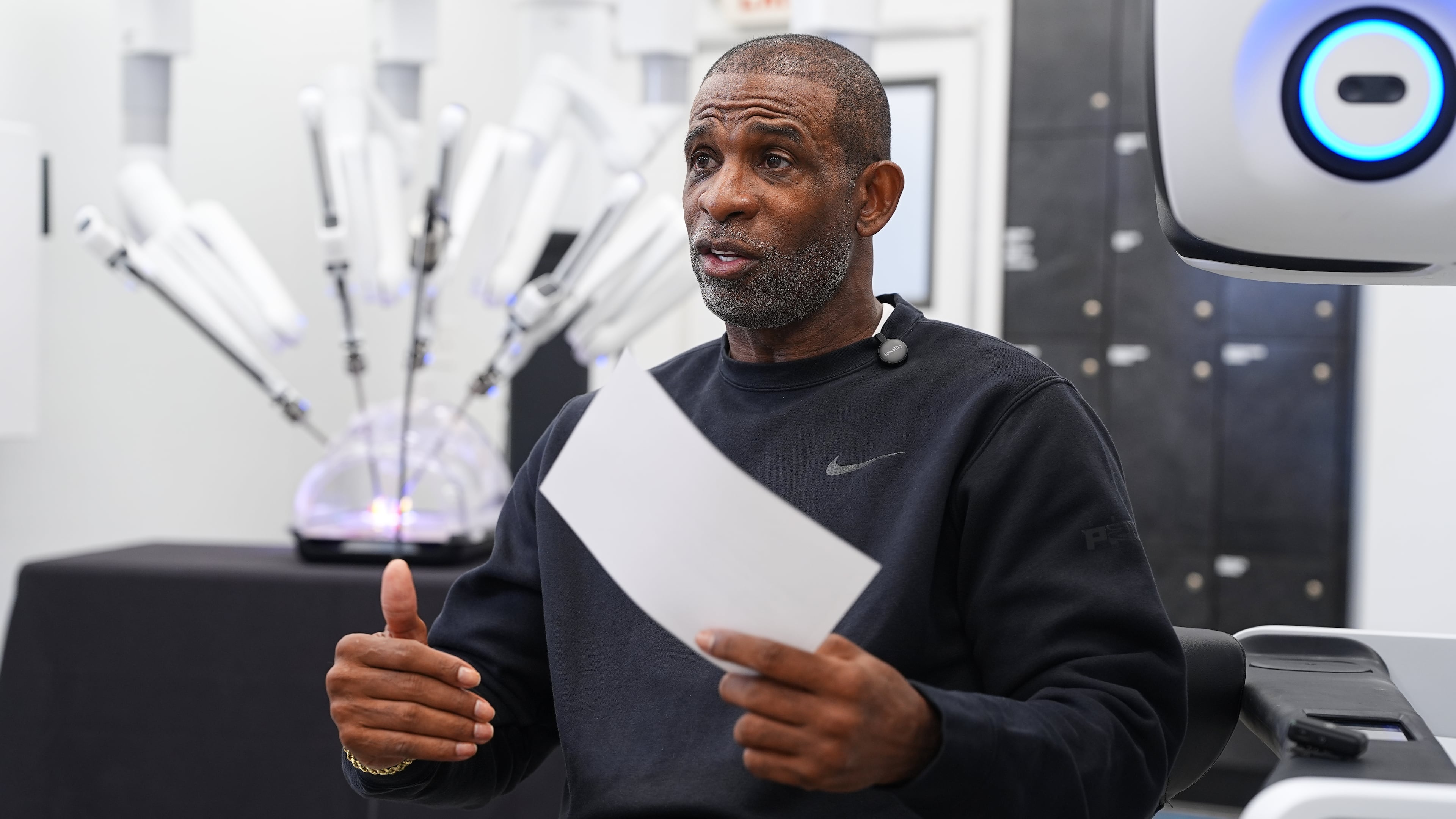 Colorado head football coach Deion Sanders talks after working the Da Vinci robotic surgical machine used to remove his cancerous bladder last year, during a demonstration of the device, Tuesday, June 23, 2026, in Boulder, Colo. (David Zalubowski/AP)