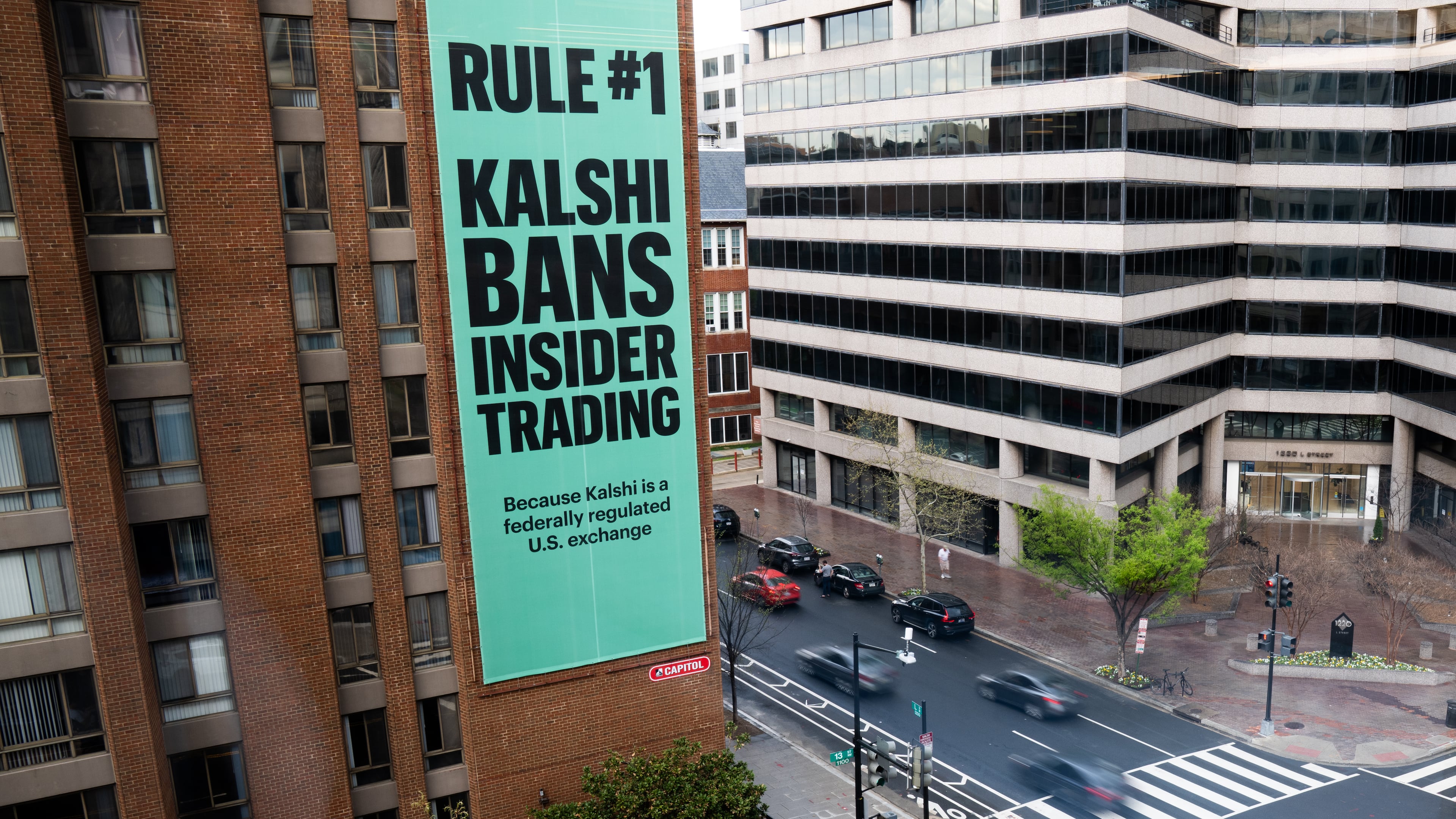 FILE - An advertisement for prediction market platform Kalshi hangs at 13th and L Streets in northwest Washington, April 1, 2026. (AP Photo/Allison Robbert, File)