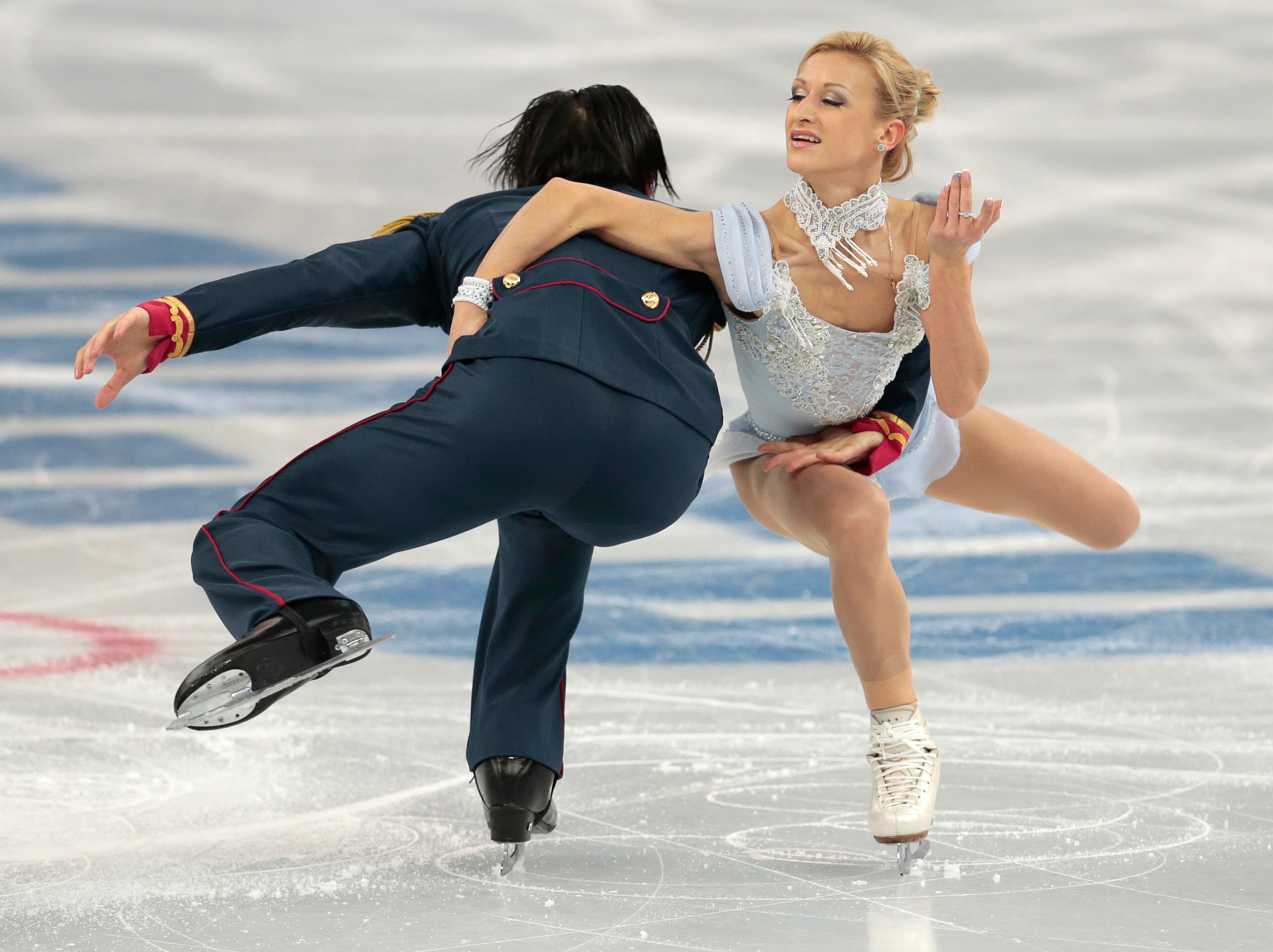 Tatiana Volosozhar and Maxim Trankov of Russia compete in the pairs short program figure skating competition at the Iceberg Skating Palace during the 2014 Winter Olympics, Tuesday, Feb. 11, 2014, in Sochi, Russia. (AP Photo/Ivan Sekretarev)