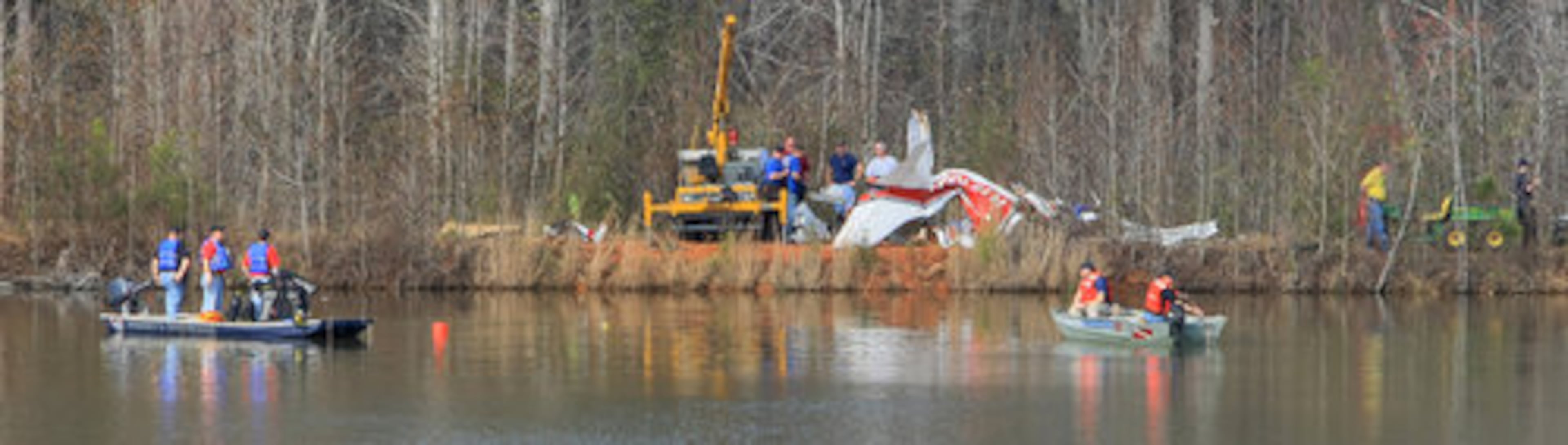 Carroll County fire chief Gary Thomas said Thomas said visibility in the lake was 'near zero.' He said some of the wreckage was lying under 20 feet of water in the deepest part of the lake.