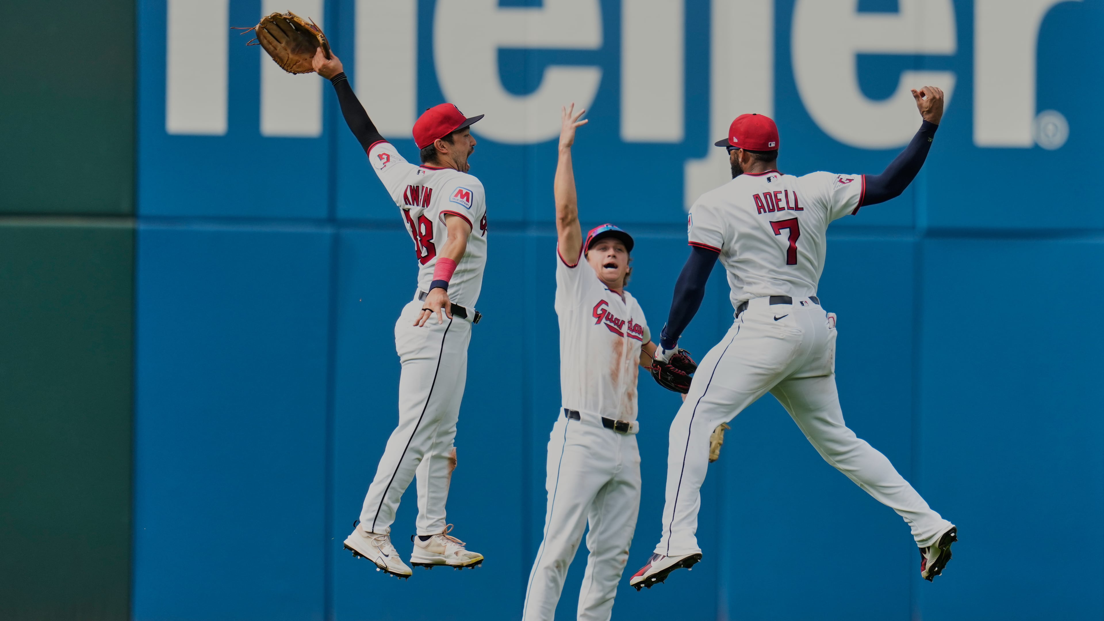 Cleveland Guardians left fielder Steven Kwan, left, center fielder Petey Halpin, center, and right fielder Jo Adell (7) celebrate after the Guardians defeated the Chicago White Sox in a baseball game in Cleveland, Wednesday, Sept. 16, 2026. (AP Photo/Sue Ogrocki)