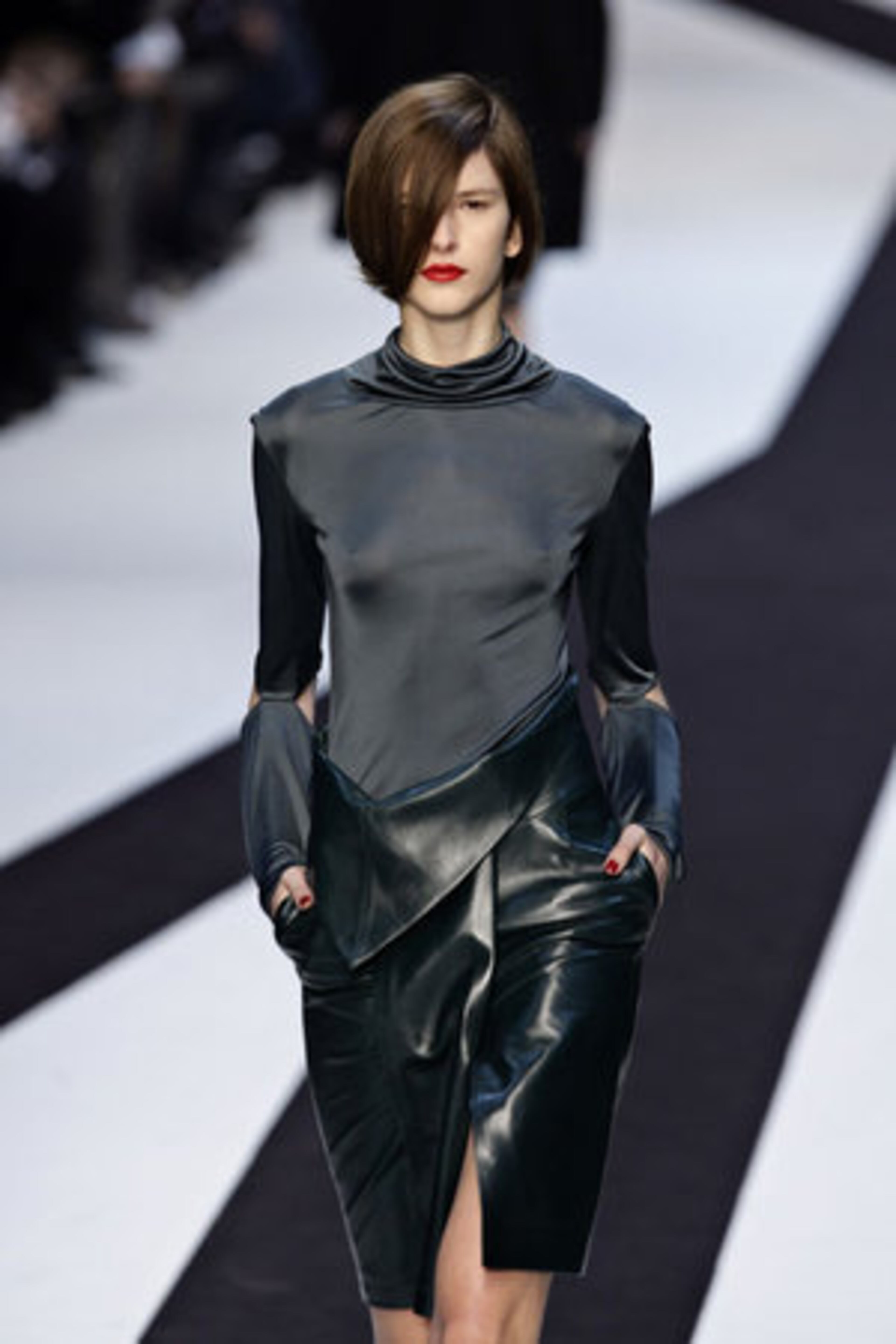 The collection was accented with models wearing pops of red on the lips and nails.