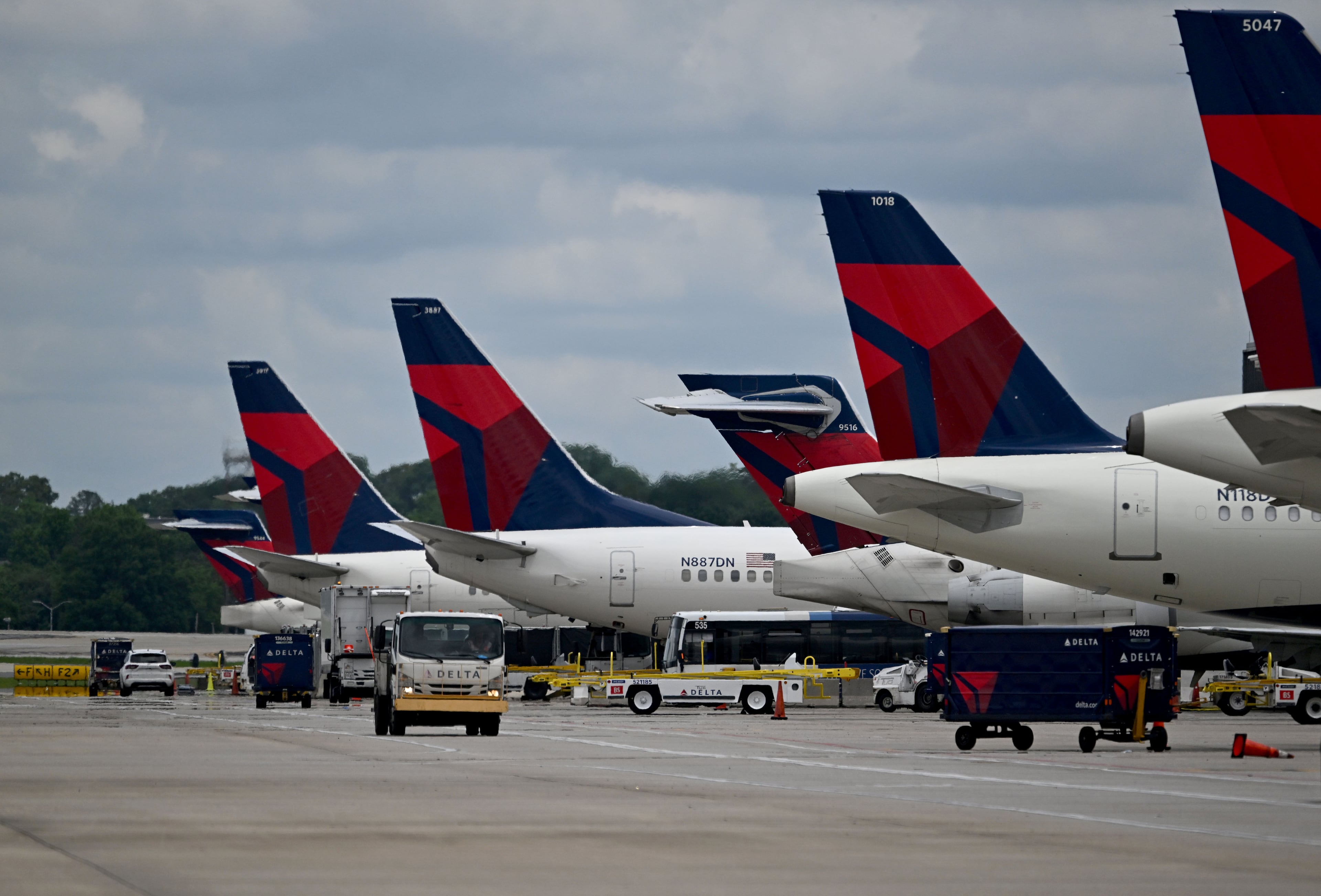 Delta airplanes on the airport ramp at Hartsfield-Jackson Atlanta International Airport in May. (Hyosub Shin/AJC)