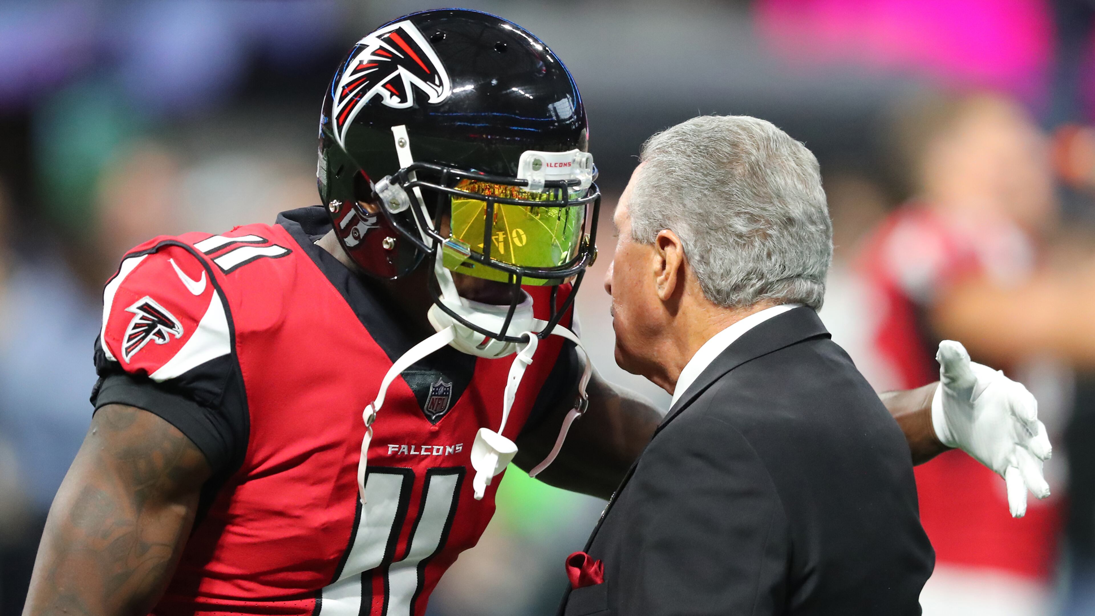Julio Jones gives Falcons owner Arthur Blank a hug before playing the Cowboys Sunday, Nov. 12, 2017, in Atlanta.
