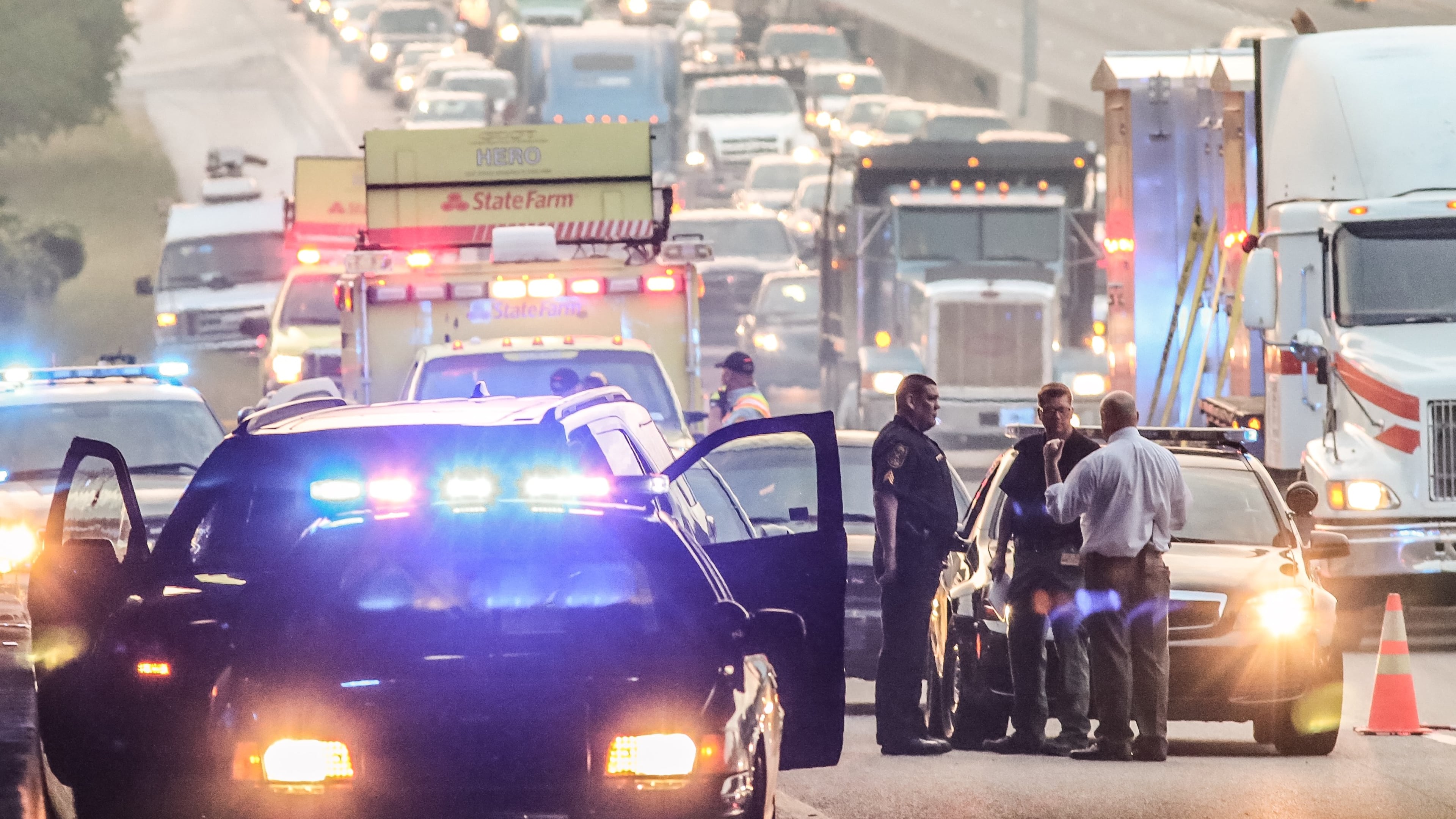 Police conduct an investigation after a person was found dead in an SUV on I-20 in DeKalb County, Thursday May 12 2016.