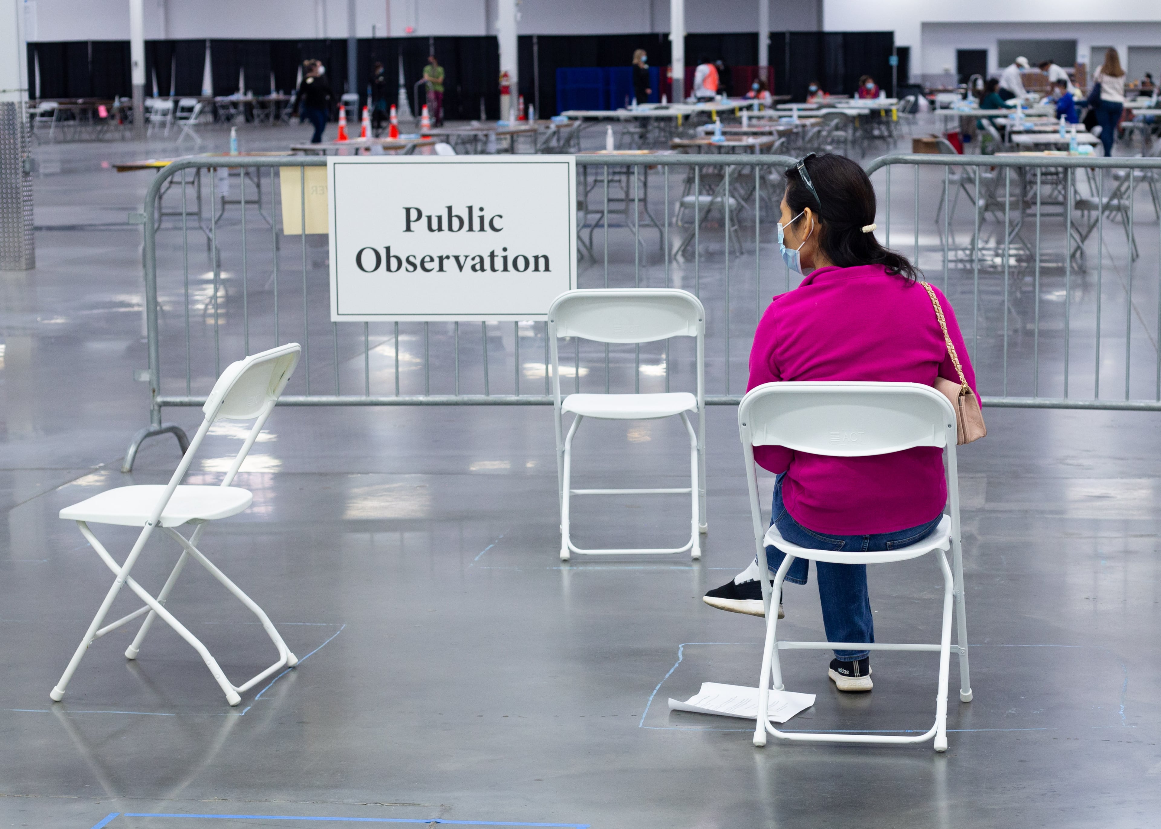 Public observers watch as people recount ballots from the 2020 presidential election on Sunday, Nov. 15, 2020, in Stonecrest. (Rebecca Wright for the Atlanta Journal-Constitution)