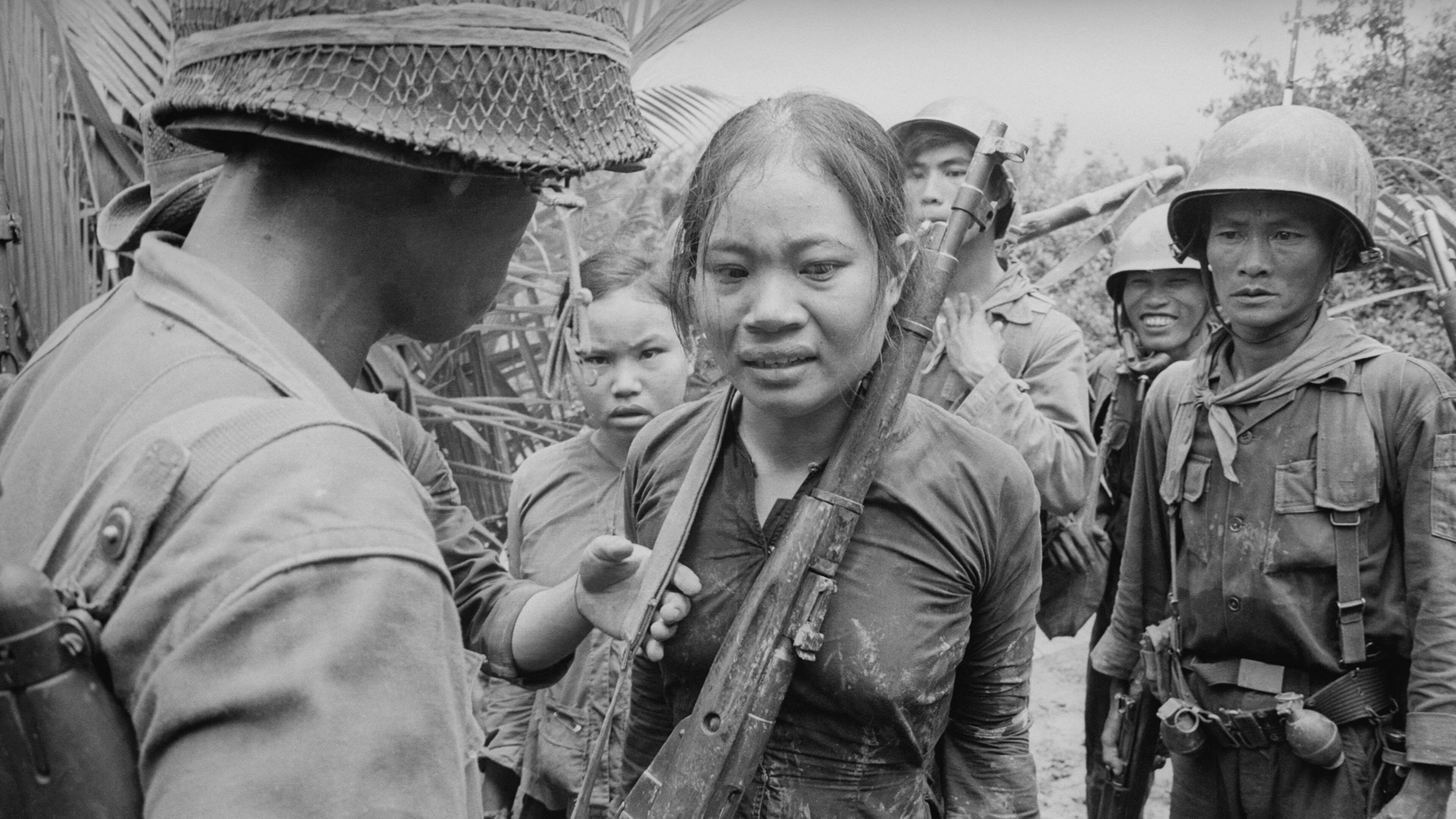 Suspected Viet Cong soldier carrying a Russian-made rifle, awaiting interrogation. August 25, 1965. Credit: Courtesy of The Associated Press